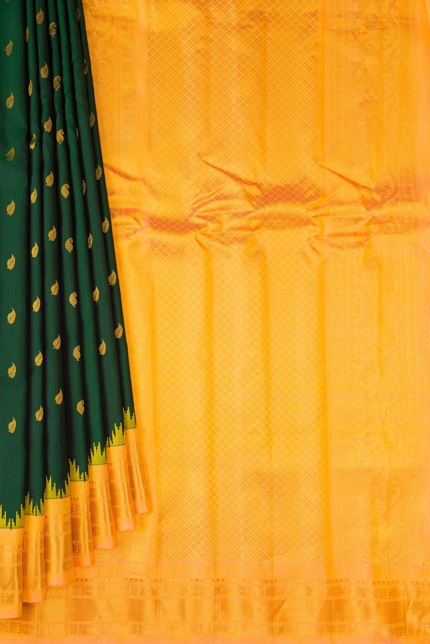 Pleats and pallu of Bottle Green Gadwal Silk Saree with Zari Butta on the body and Zari Border. 