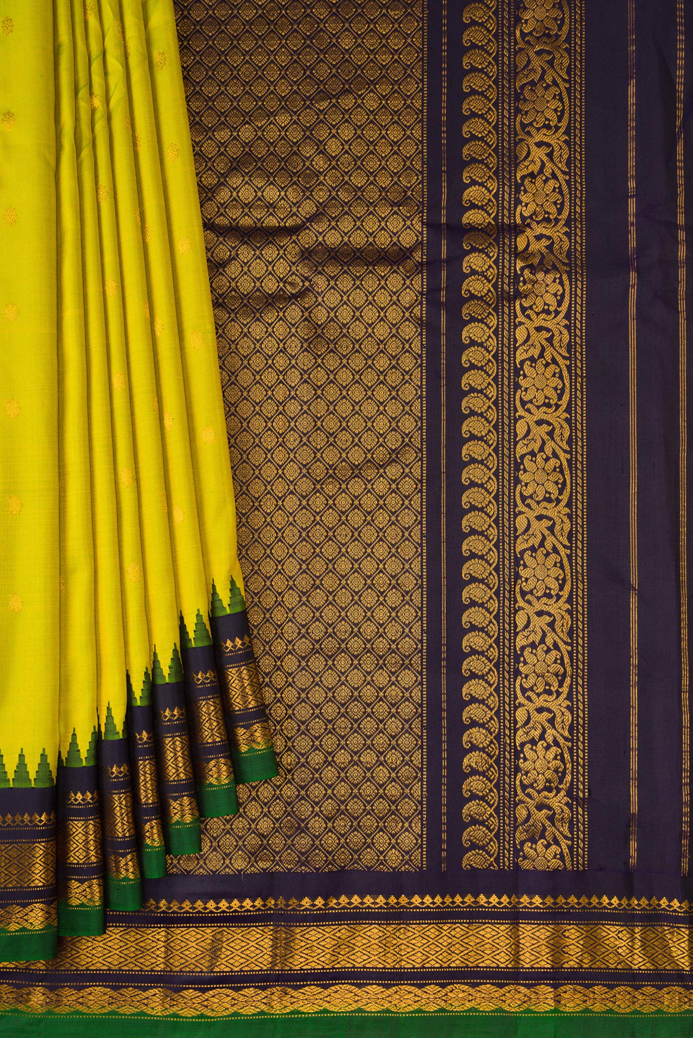 Pleats and pallu of Parrot Green Gadwal Silk Saree with Zari Butta on the body and Temple Border. 