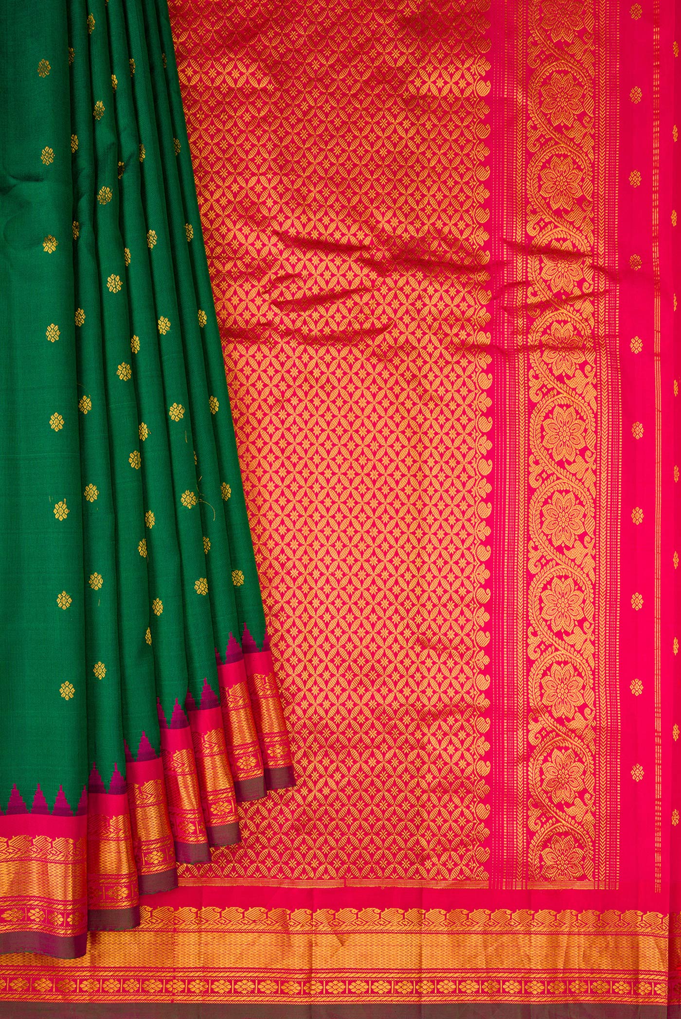 Pleats and pallu of Bottle Green Gadwal Silk Saree with Zari Butta on the body and Temple Border. 