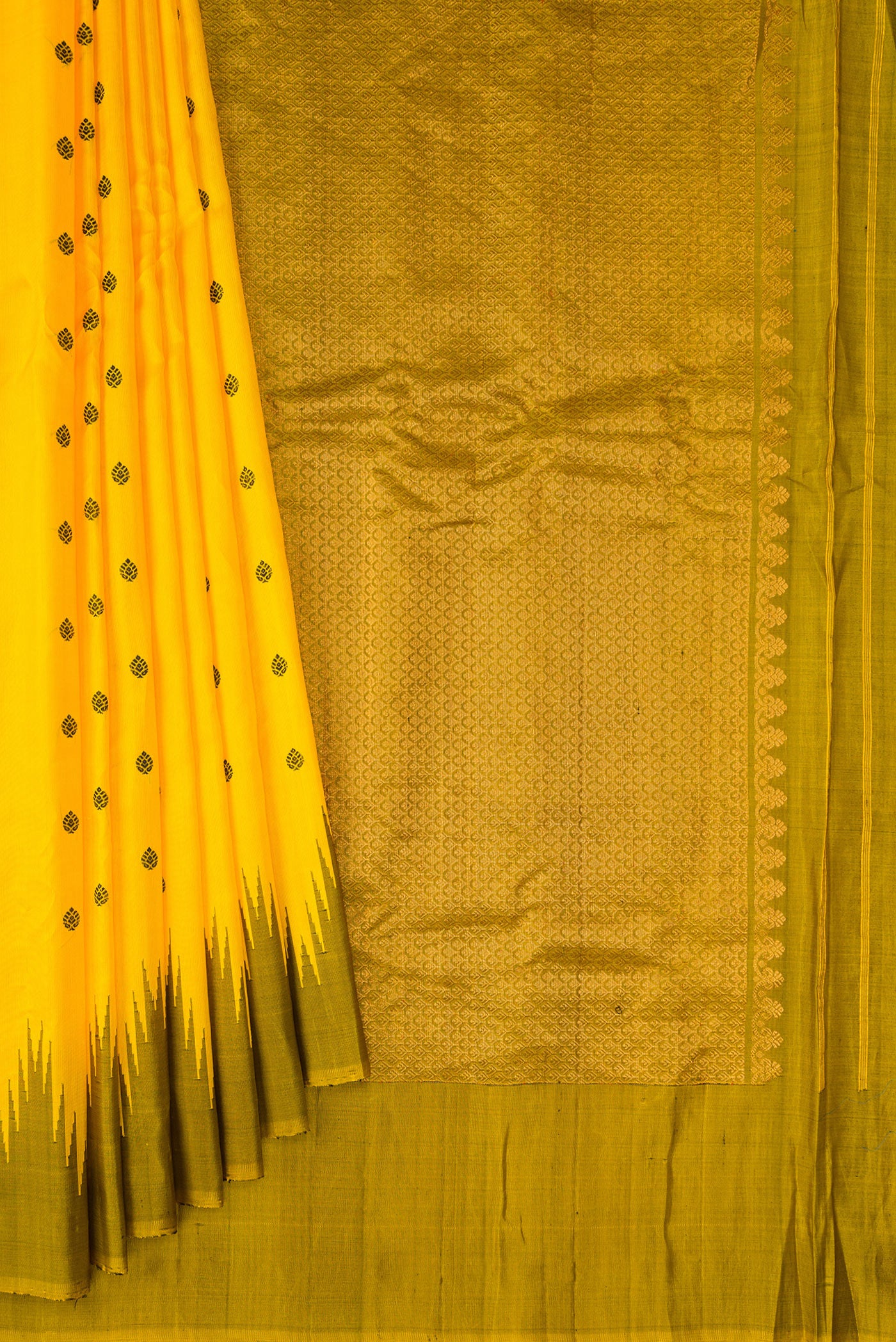 Pleats and pallu of Yellow Gadwal Silk Saree with Thread Butta on the body and Temple Border. 
