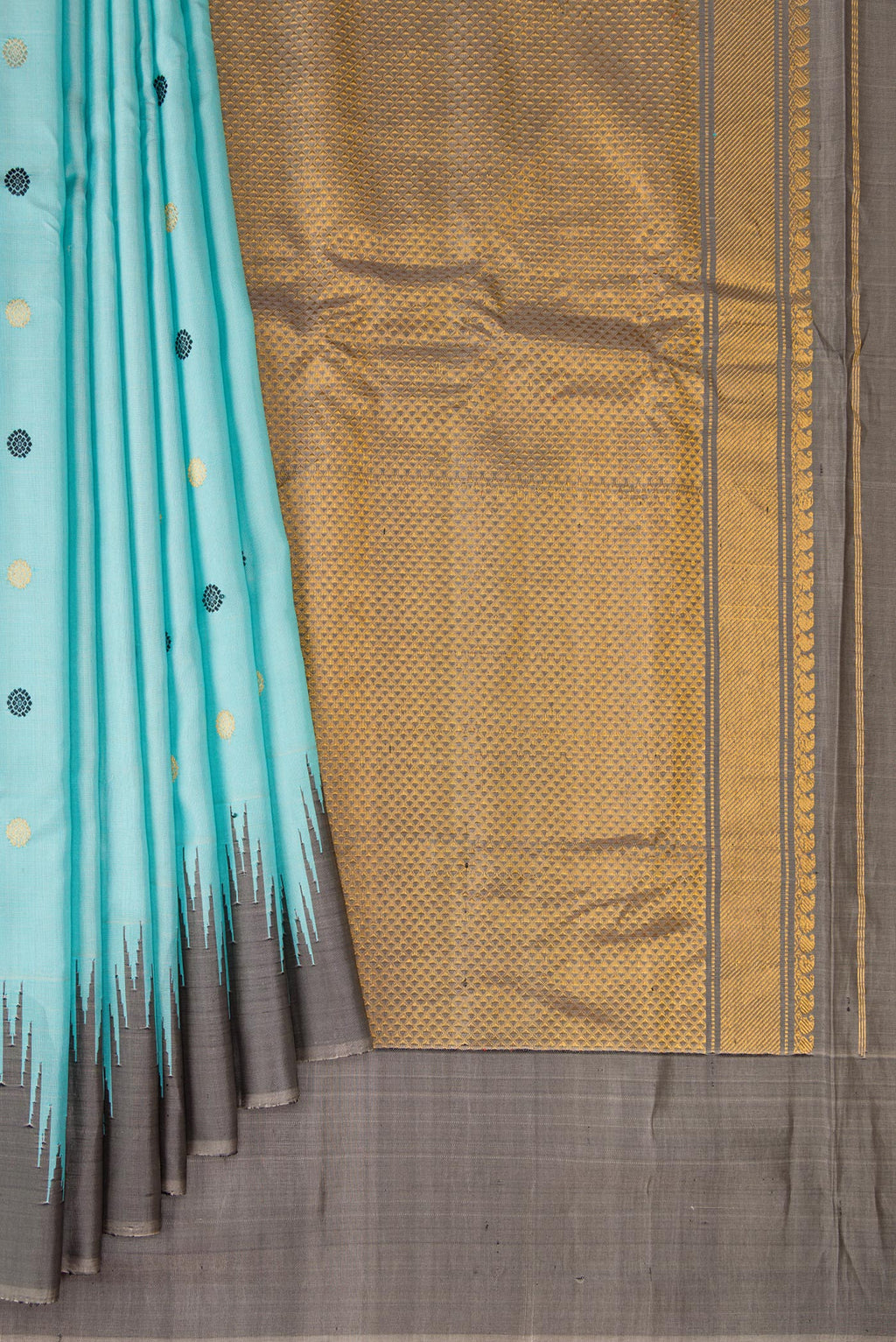 Pleats and pallu of Sky Blue Gadwal Silk Saree with Zari And Thread Butta on the body and Temple Border. 