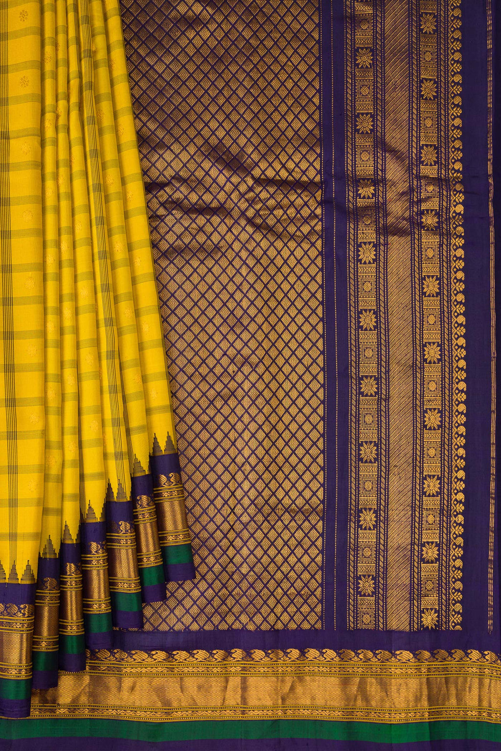 Pleats and pallu of Yellow Gadwal Silk Saree with Checked design on the body and Temple Border. 