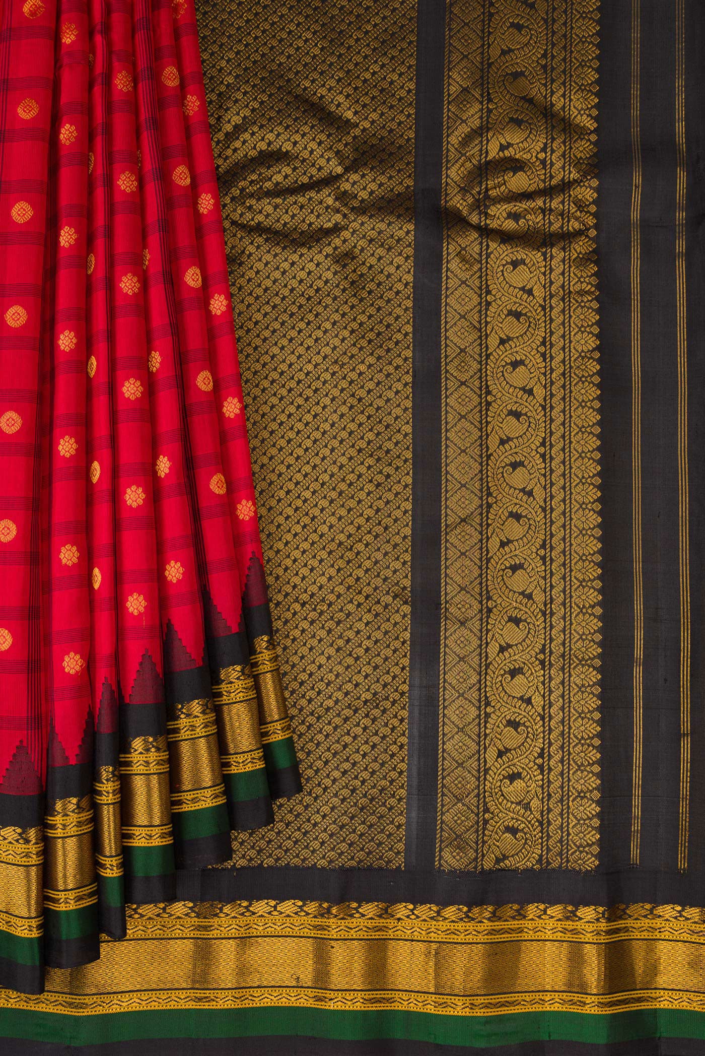 Pleats and pallu of Red Gadwal Silk Saree with Checked design on the body and Temple Border. 