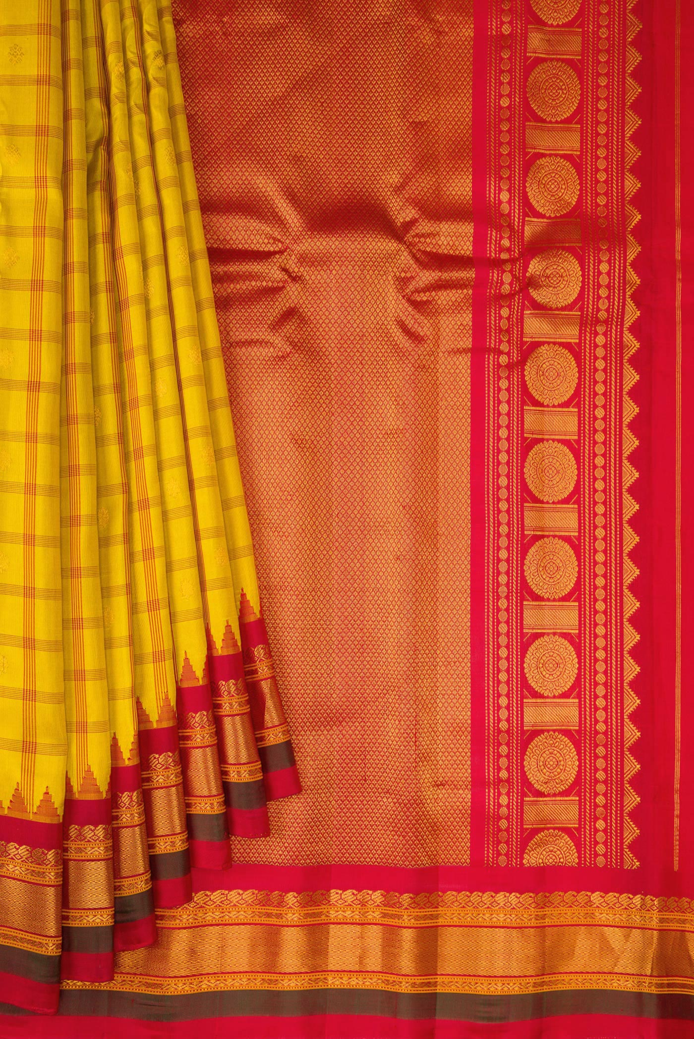 Pleats and pallu of Yellow Gadwal Silk Saree with Checked design on the body and Zari Border. 