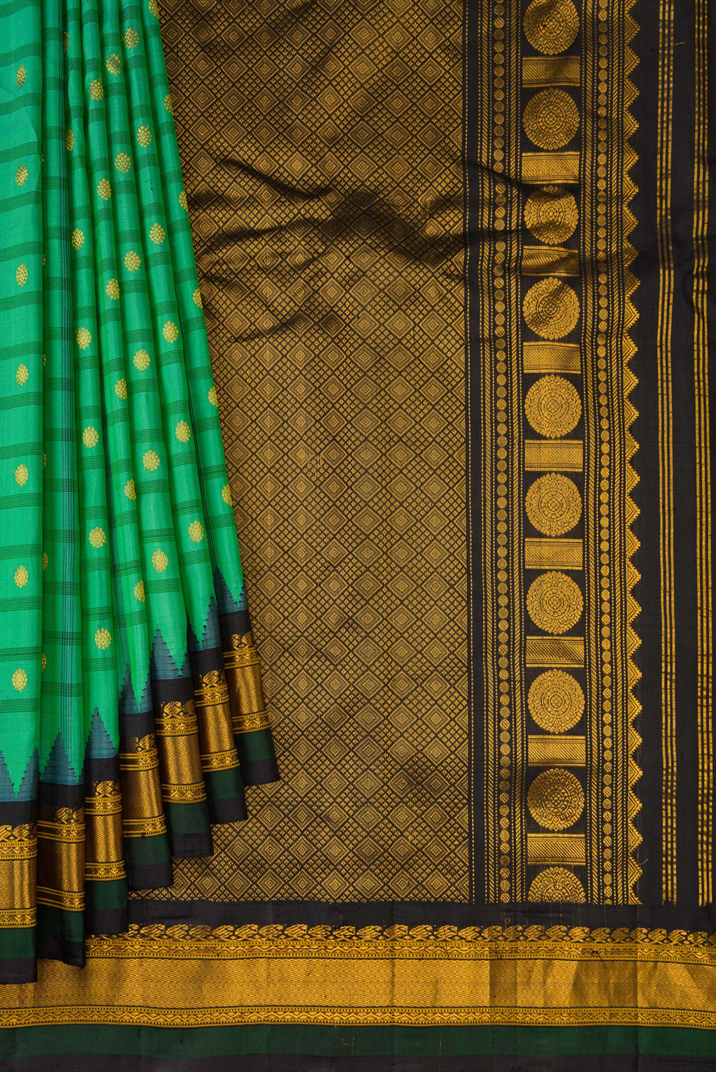 Pleats and pallu of Sea Green Gadwal Silk Saree with Checked design on the body and Temple Border. 