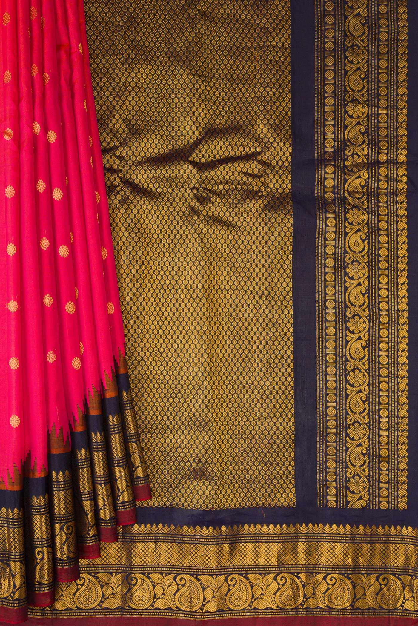 Pleats and pallu of Dark Pink Dual Tone Gadwal Silk Saree with Zari Butta on the body and Zari Border. 