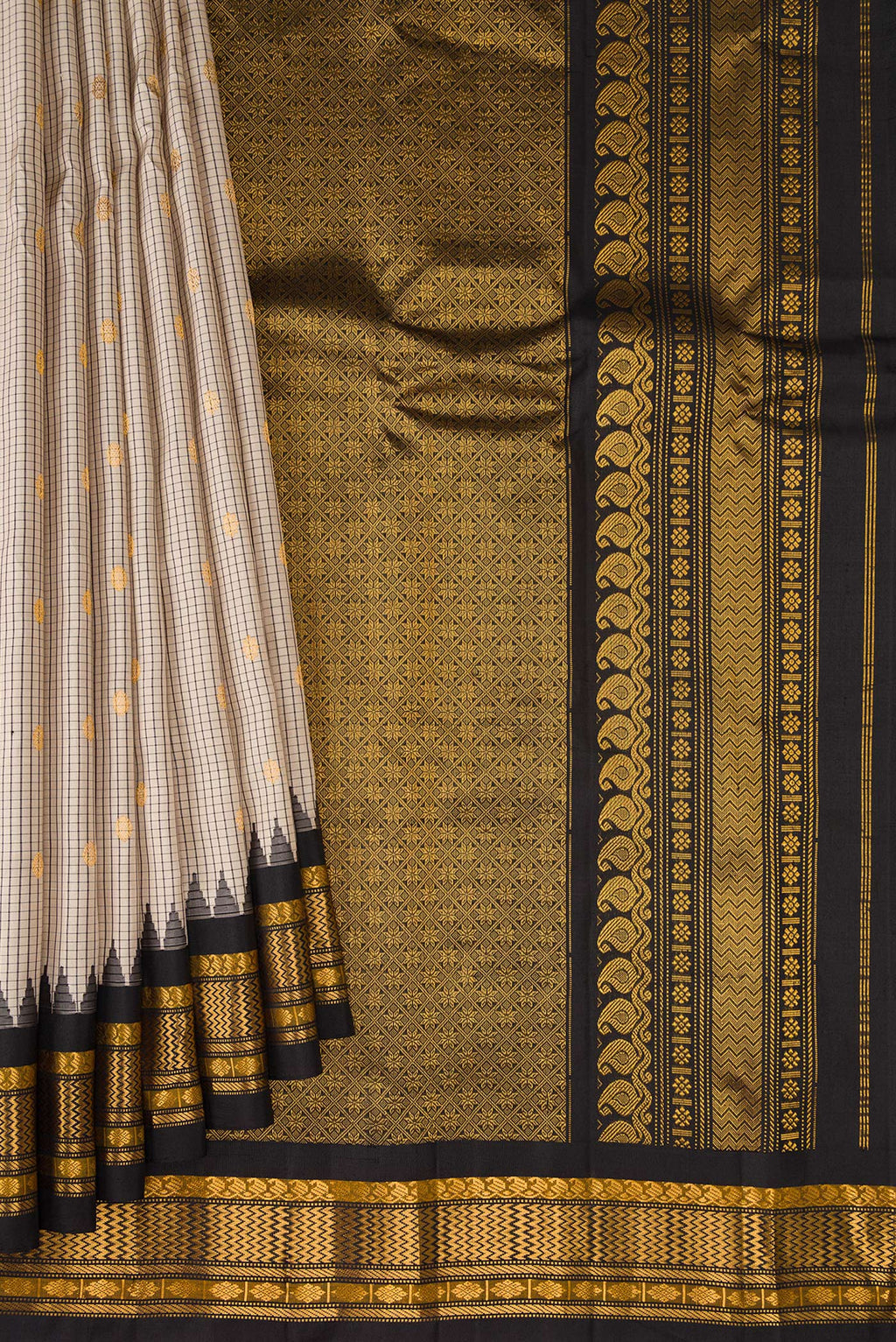 Pleats and pallu of Beige Gadwal Silk Saree with Checked design on the body and Temple Border. 