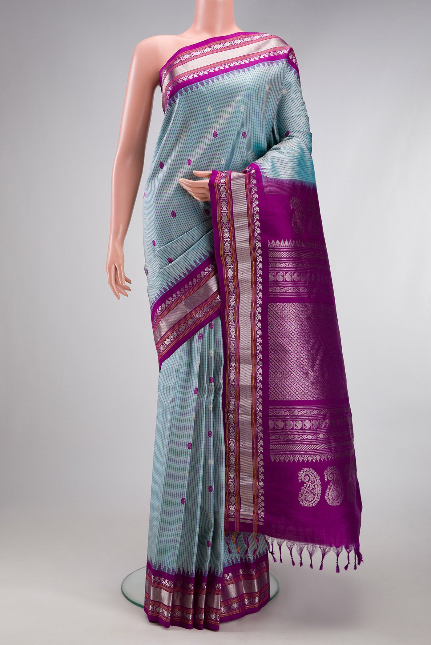 Light Blue Gadwal Silk Saree with Checked design on the body and Temple Border.  displayed on a mannequin