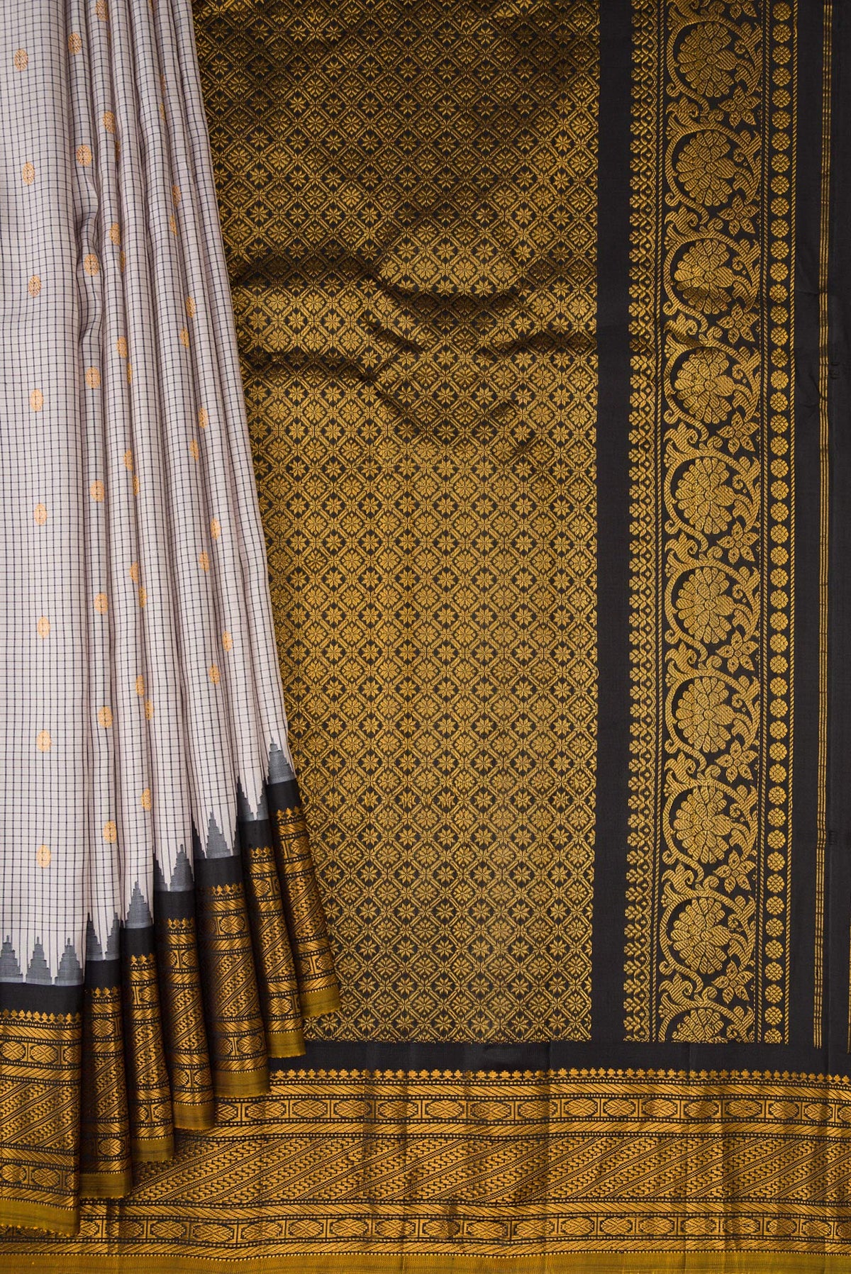 Pleats and pallu of Grey Gadwal Silk Saree with Checked design on the body and Temple Border. 