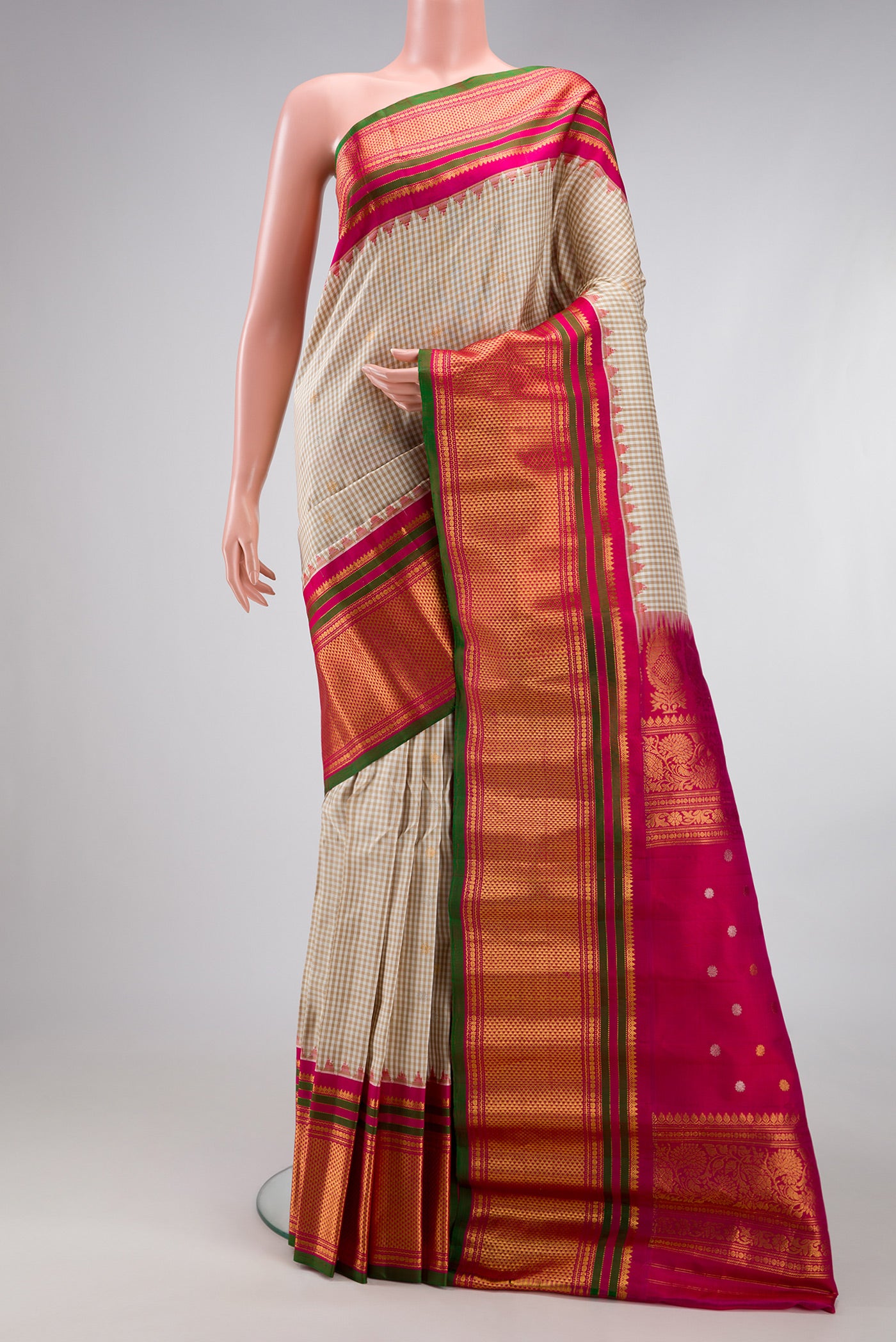Multi Color Gadwal Silk Saree with Checked design on the body and Zari Border.  displayed on a mannequin