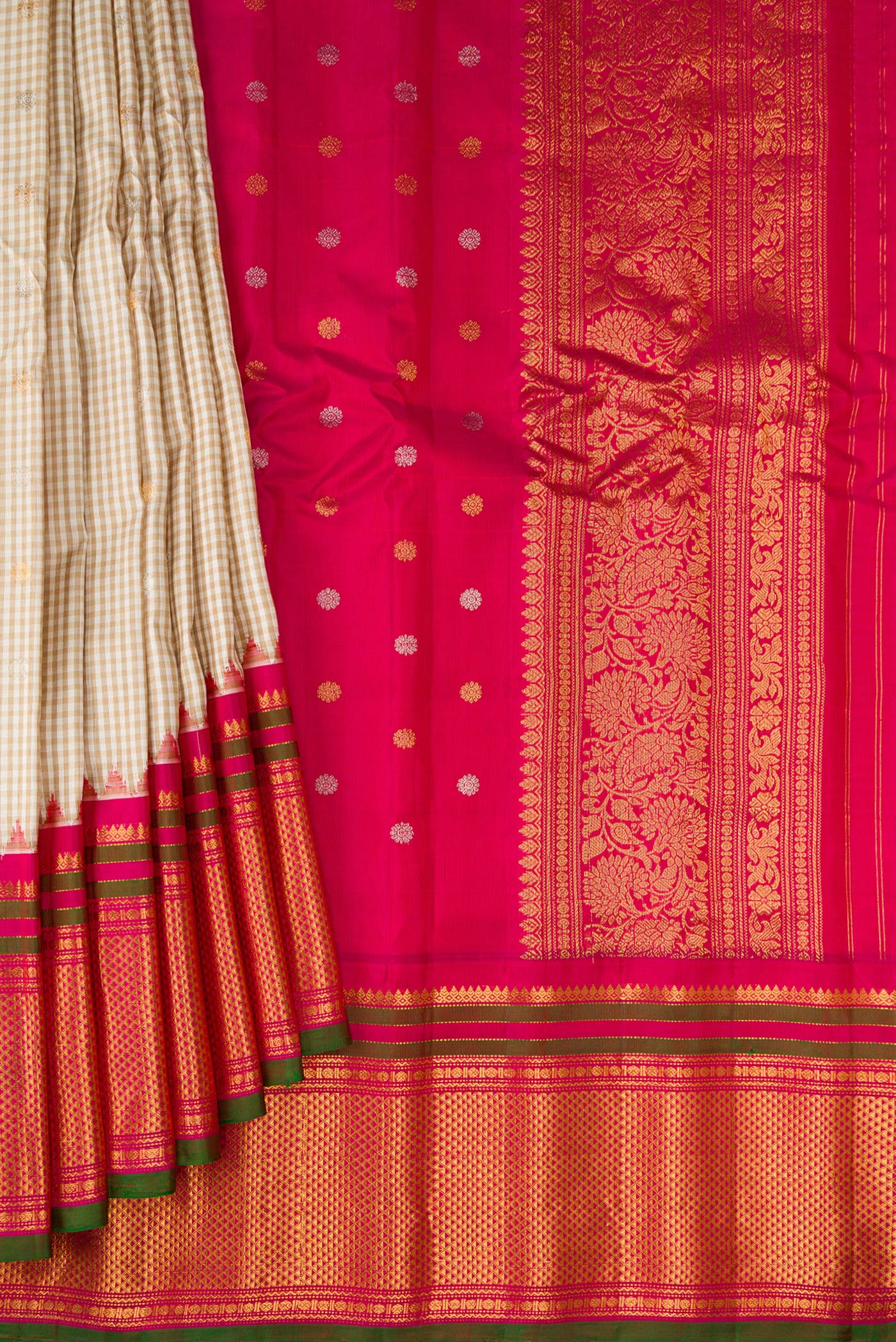 Pleats and pallu of Multi Color Gadwal Silk Saree with Checked design on the body and Zari Border. 