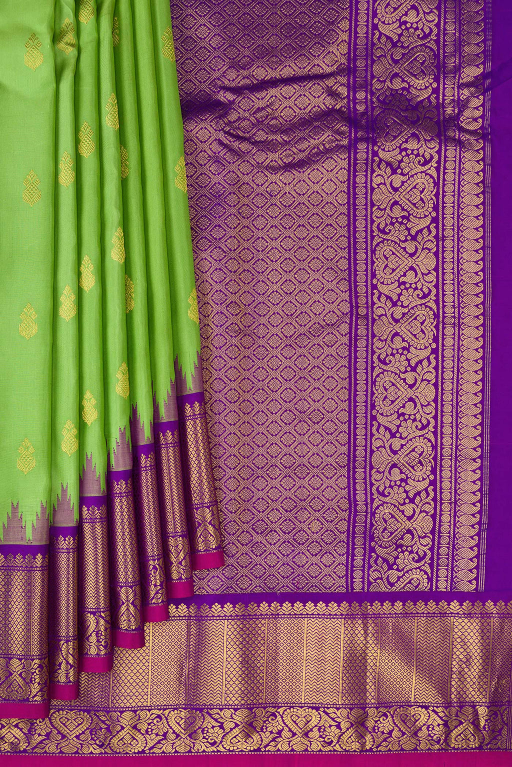 Pleats and pallu of Parrot Green Gadwal Silk Saree with Zari Butta on the body and Fancy Border. 