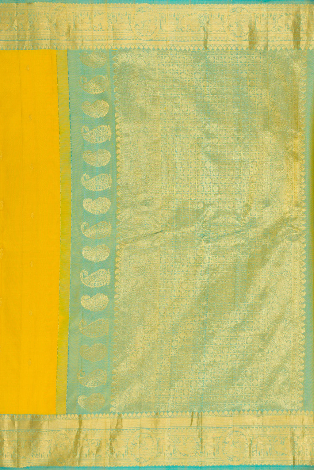 Close up image of the pallu of Yellow Gadwal Silk Saree with Zari Butta on the body and Temple Border. 