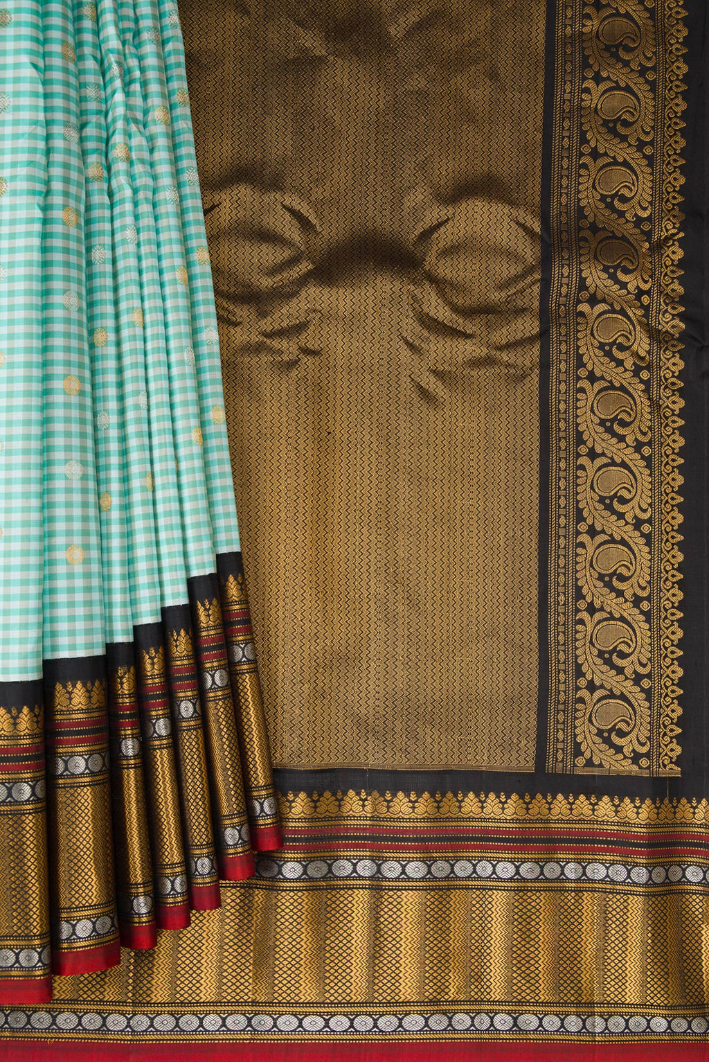 Pleats and pallu of Light Blue Gadwal Silk Saree with Checked design on the body and Zari Border. 
