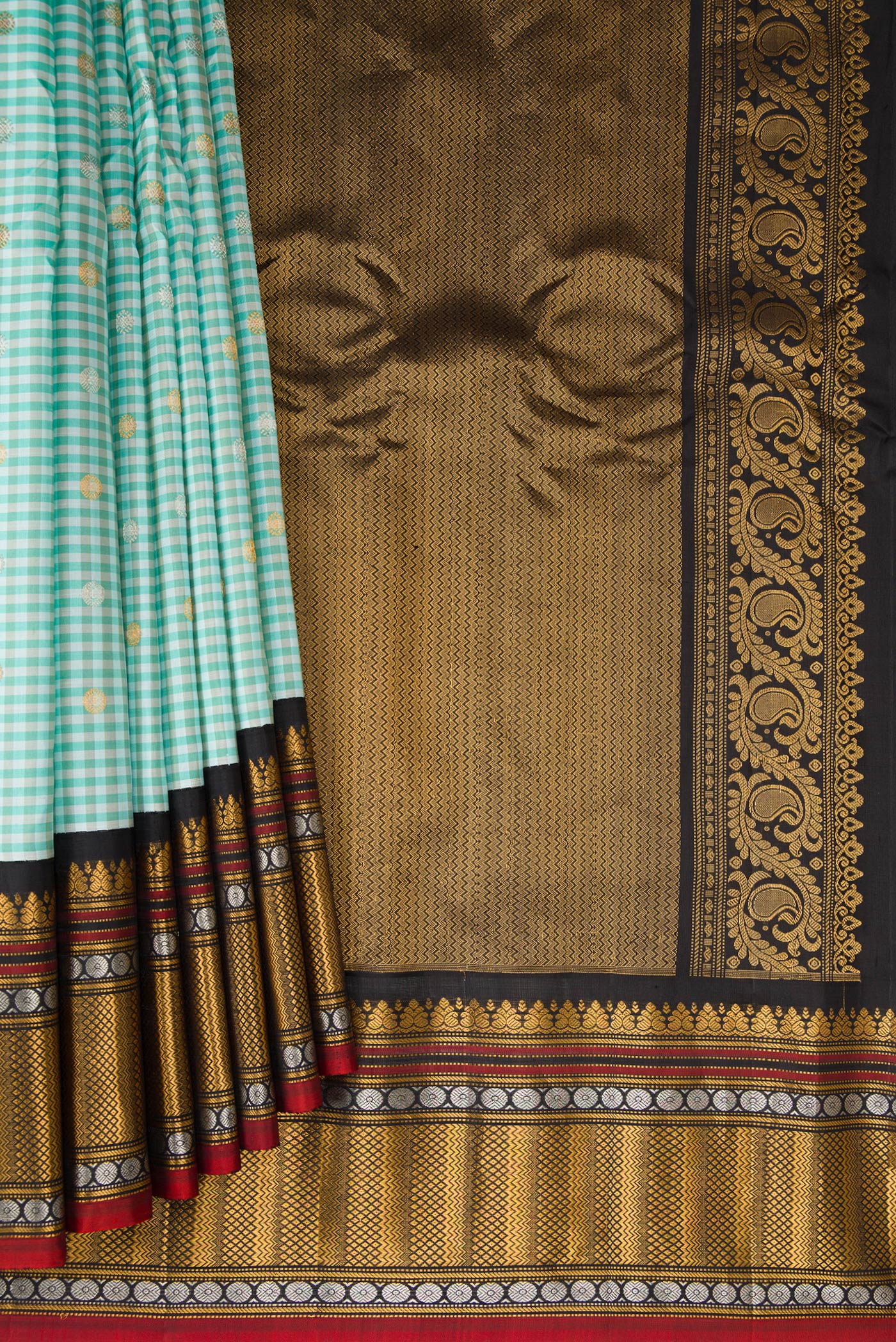 Pleats and pallu of Light Blue Gadwal Silk Saree with Checked design on the body and Zari Border. 