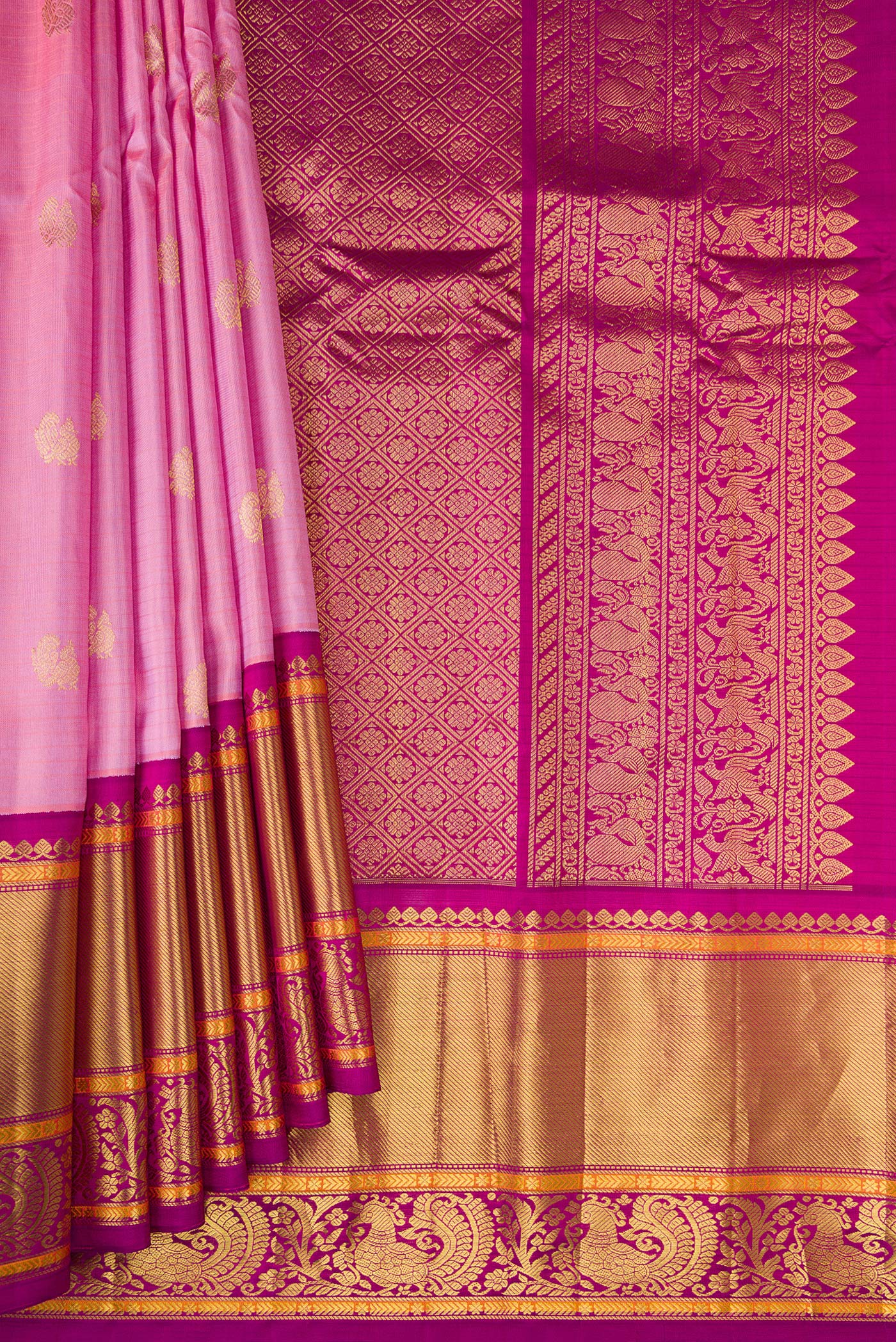 Pleats and pallu of Pink Gadwal Silk Saree with Zari Butta on the body and Zari Border. 