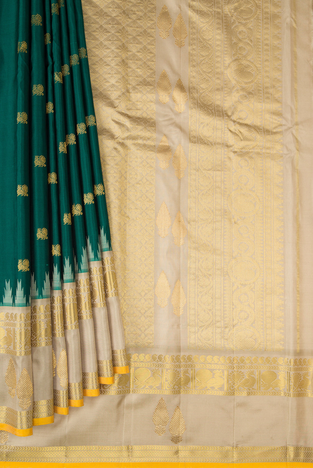 Pleats and pallu of Green Gadwal Silk Saree with Zari Butta on the body and Temple Border. 