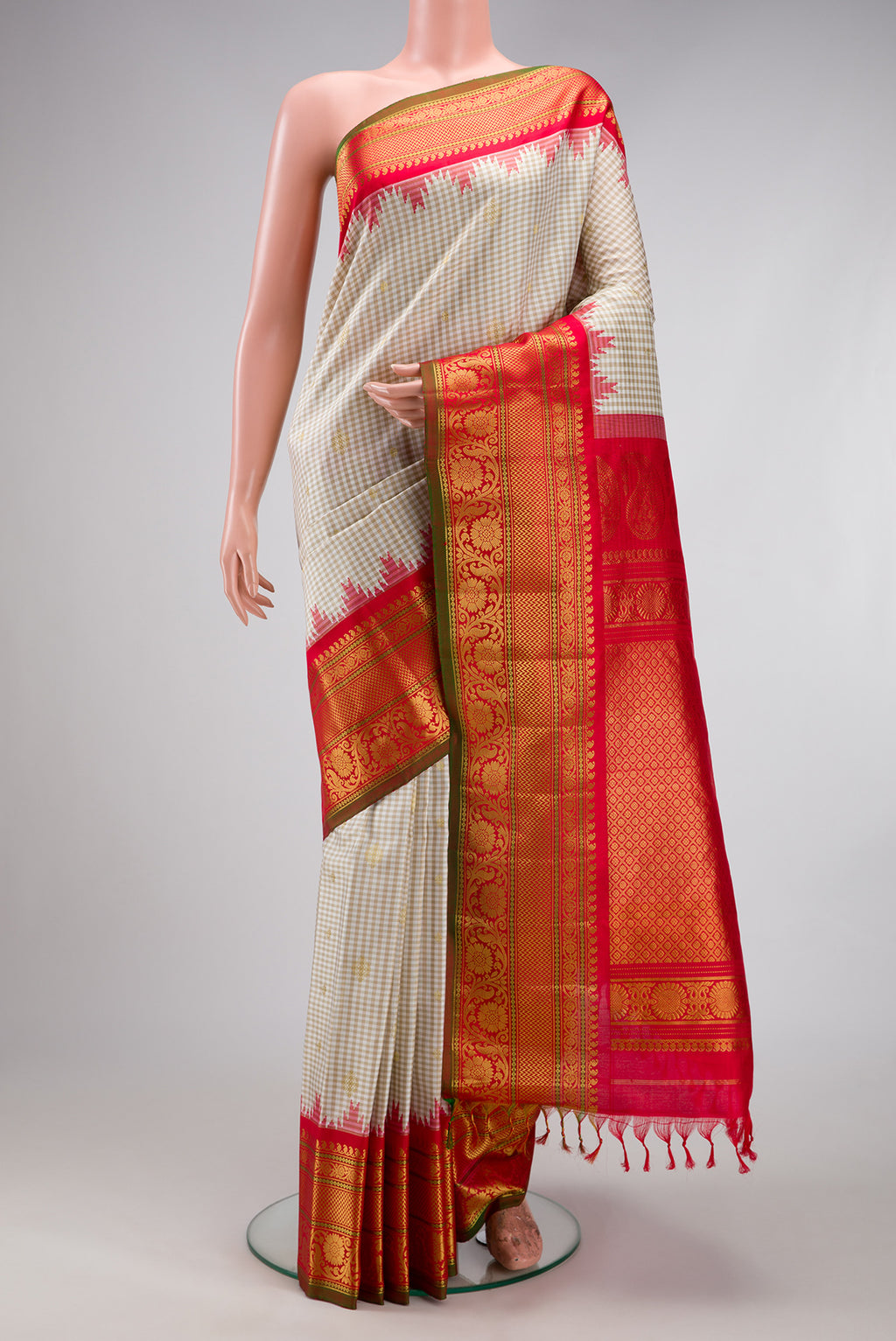 Cream Gadwal Silk Saree with Checked design on the body and Temple Border.  displayed on a mannequin