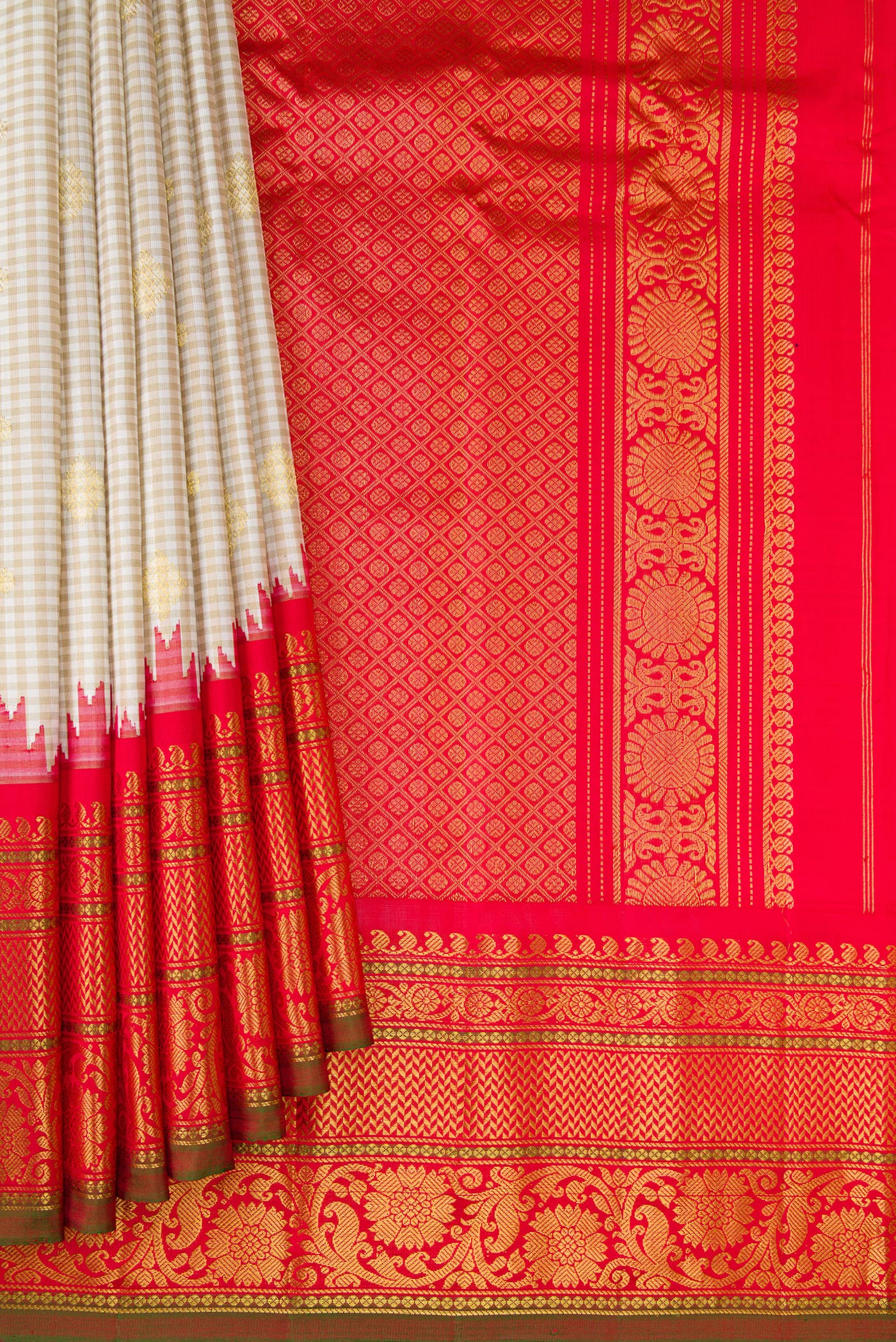 Pleats and pallu of Cream Gadwal Silk Saree with Checked design on the body and Temple Border. 