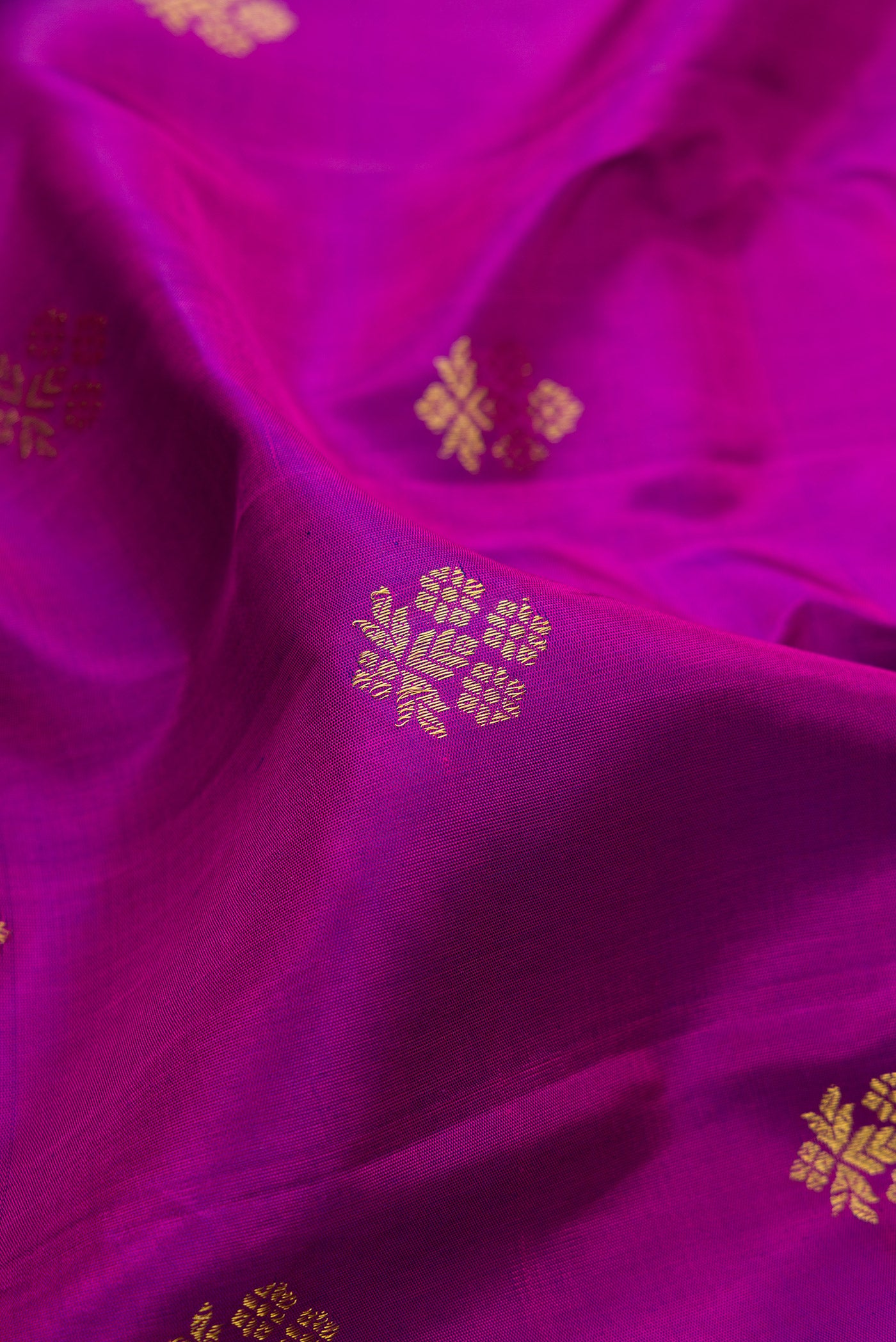 Close up of Purple Gadwal Silk Saree with Zari Butta on the body and Zari Border.  displaying folds