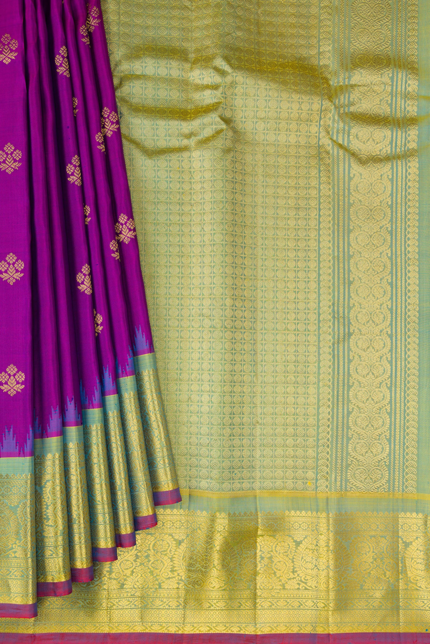 Pleats and pallu of Purple Gadwal Silk Saree with Zari Butta on the body and Zari Border. 