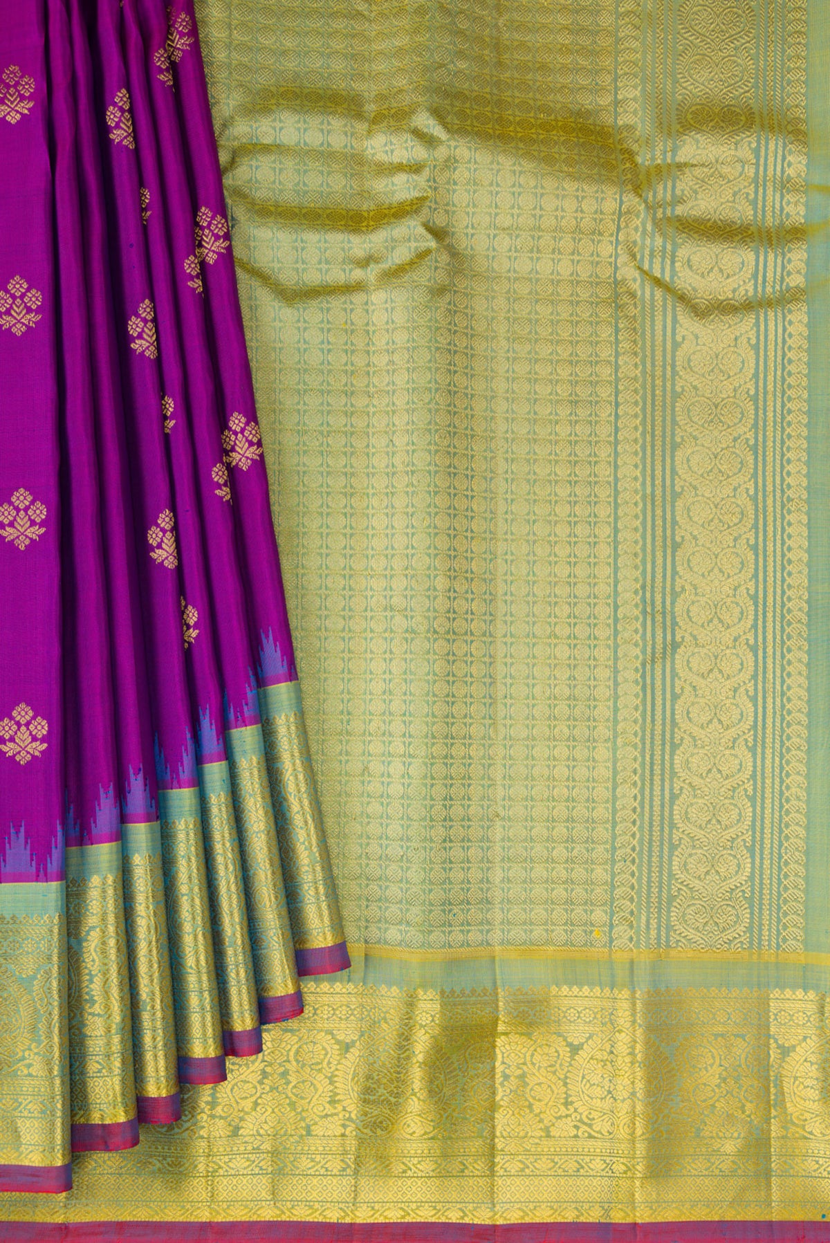 Pleats and pallu of Purple Gadwal Silk Saree with Zari Butta on the body and Zari Border. 
