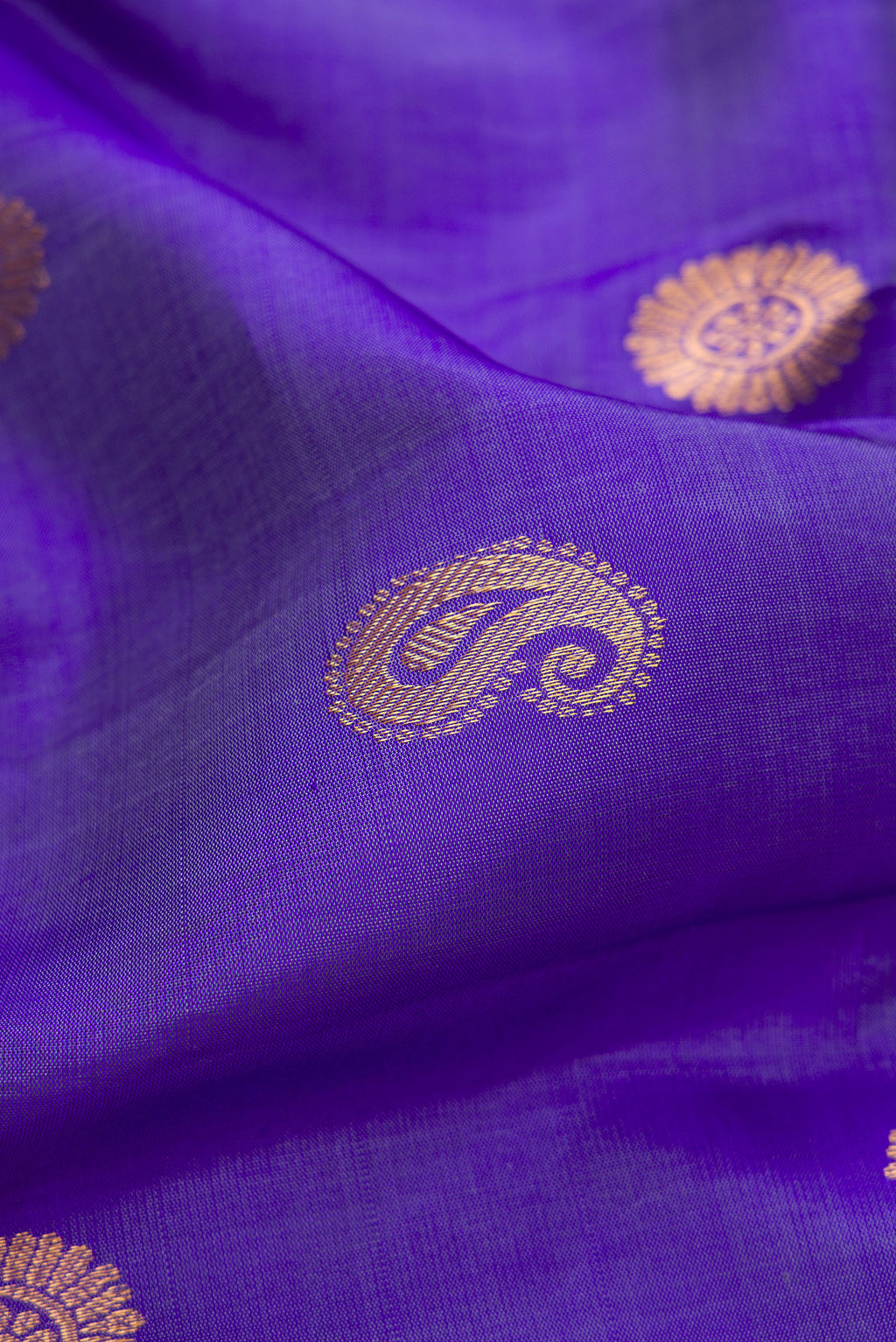 Close up of Blue Gadwal Silk Saree with Zari Butta on the body and Zari Border.  displaying folds