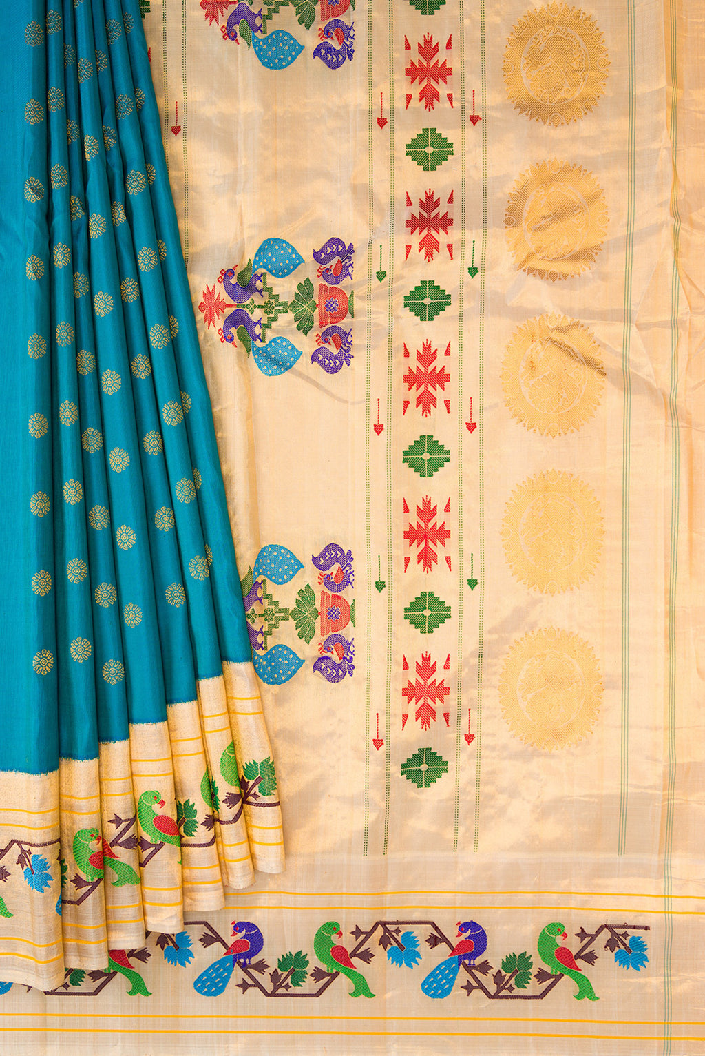 Pleats and pallu of Peacock Blue Paithani Silk Saree with Zari Butta on the body and Paithani Border. 