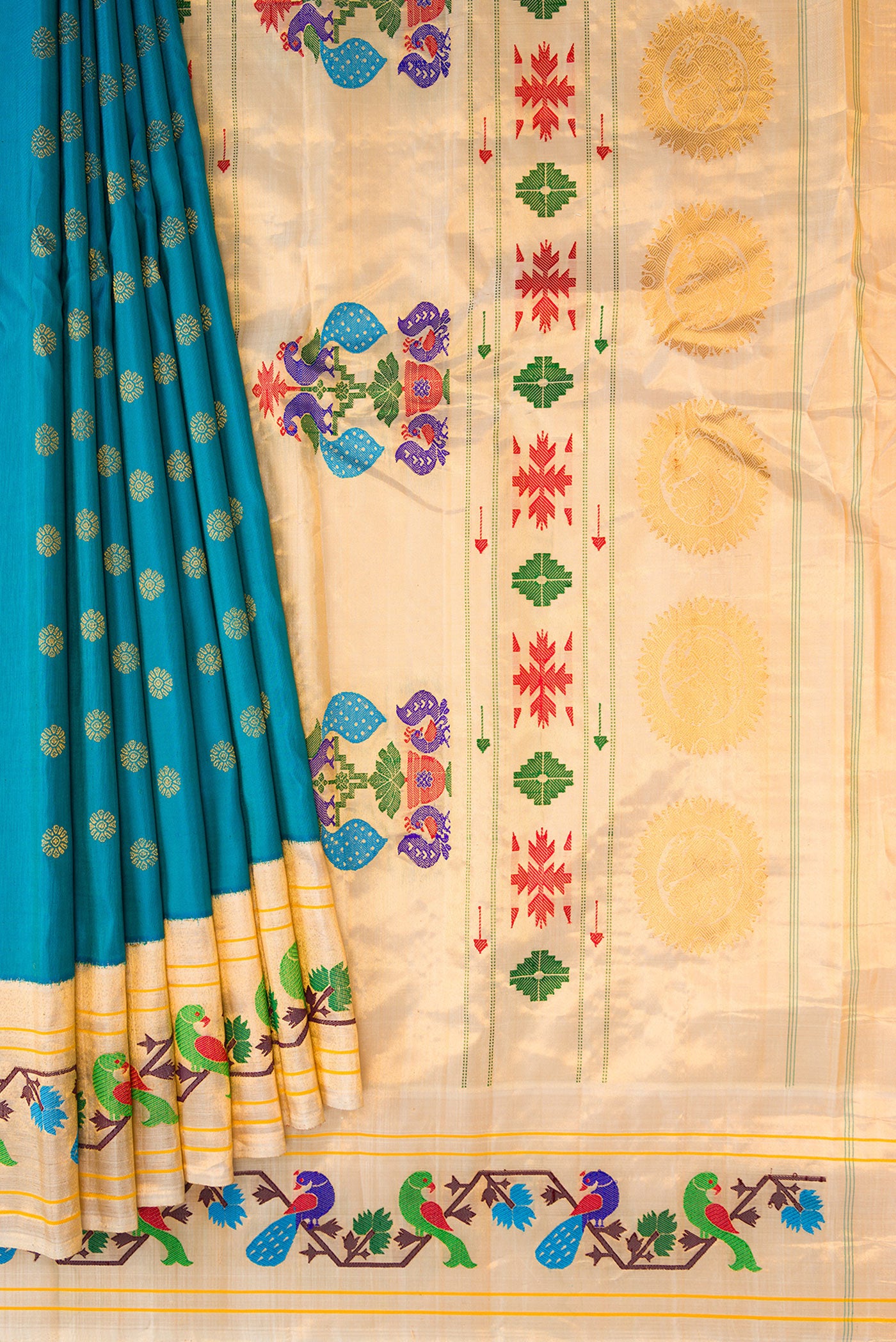 Pleats and pallu of Peacock Blue Paithani Silk Saree with Zari Butta on the body and Paithani Border. 