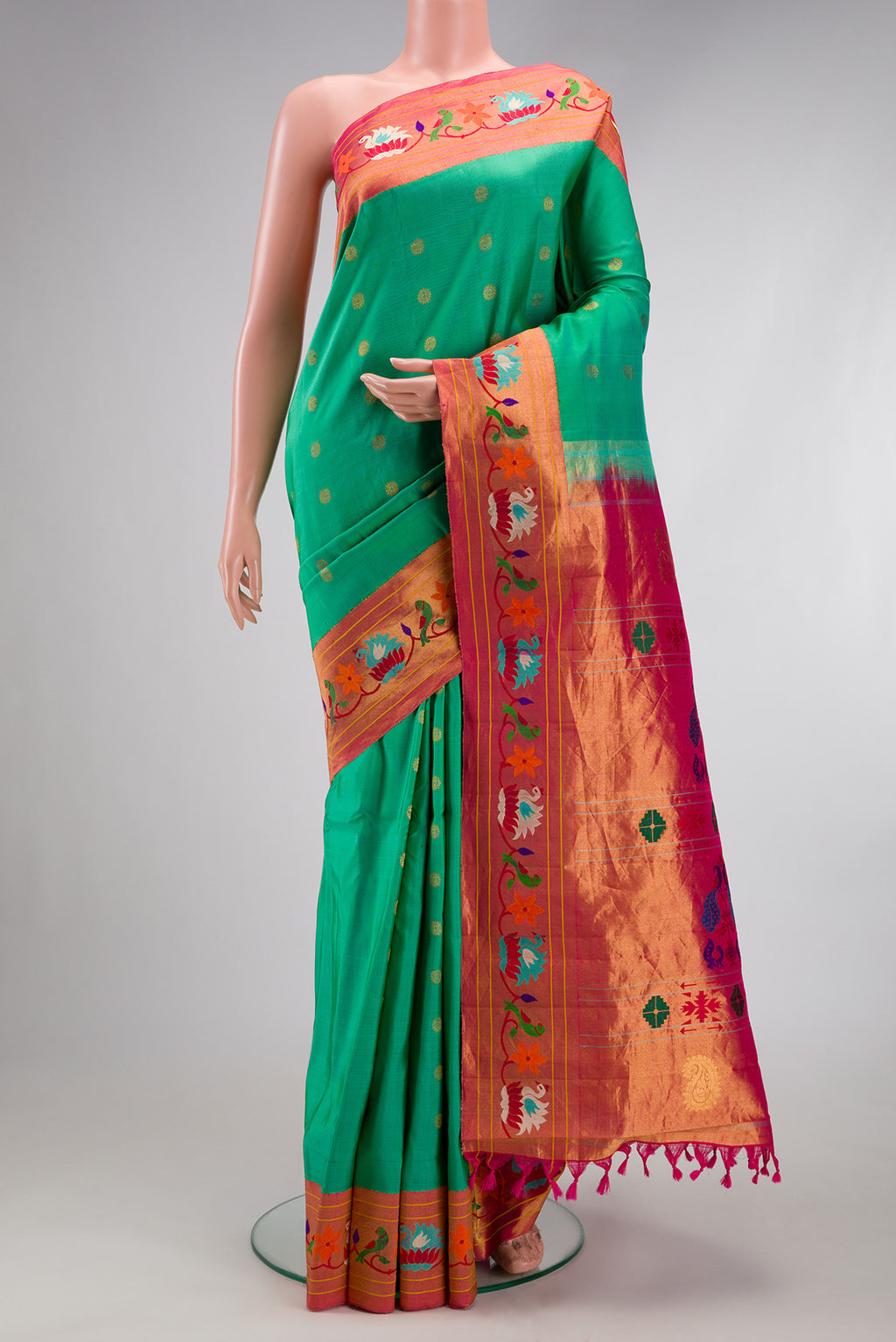 Sea Green Paithani Silk Saree with Zari Butta on the body and Paithani Border.  displayed on a mannequin