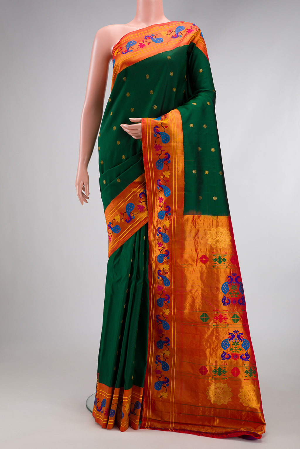 Bottle Green Paithani Silk Saree with Zari Butta on the body and Paithani Border.  displayed on a mannequin