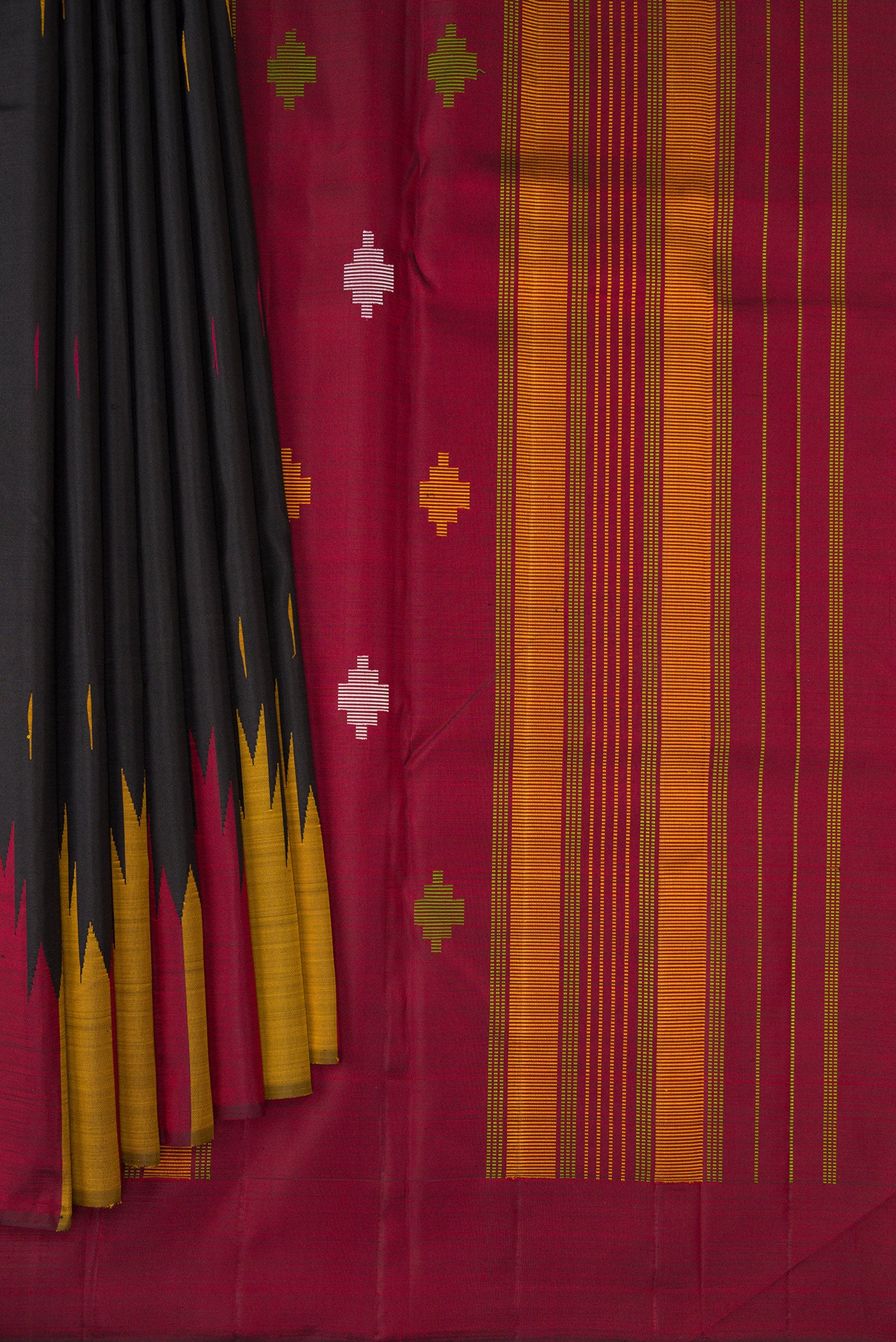 Pleats and pallu of Black Kanchipuram Silk Saree with Thread Butta on the body and Temple Border. 