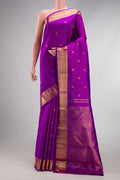 Pure Silk Pure Zari Magenta Dual Tone Kanjivaram Saree with Zari Butta on the body and Zari Border.  displayed on a mannequin