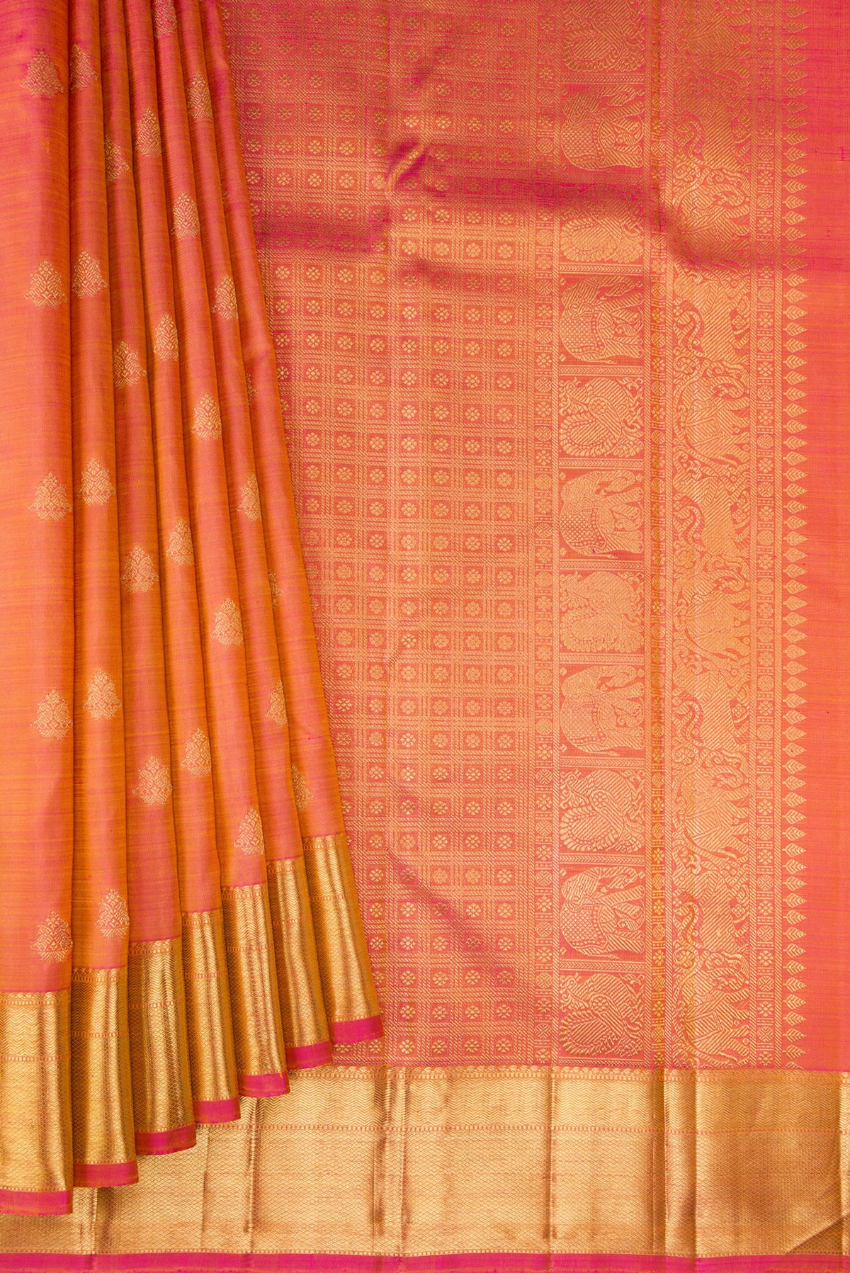 Pleats and pallu of Pure Silk Pure Zari Coral Dual Tone Kanjivaram Saree with Zari Butta on the body and Zari Border. 