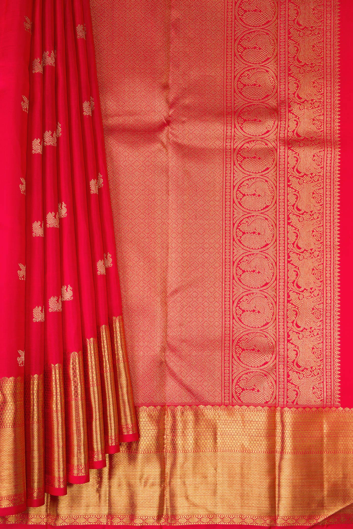Pleats and pallu of Pure Silk Pure Zari Red Dual Tone Kanjivaram Saree with Zari Butta on the body and Zari Border. 