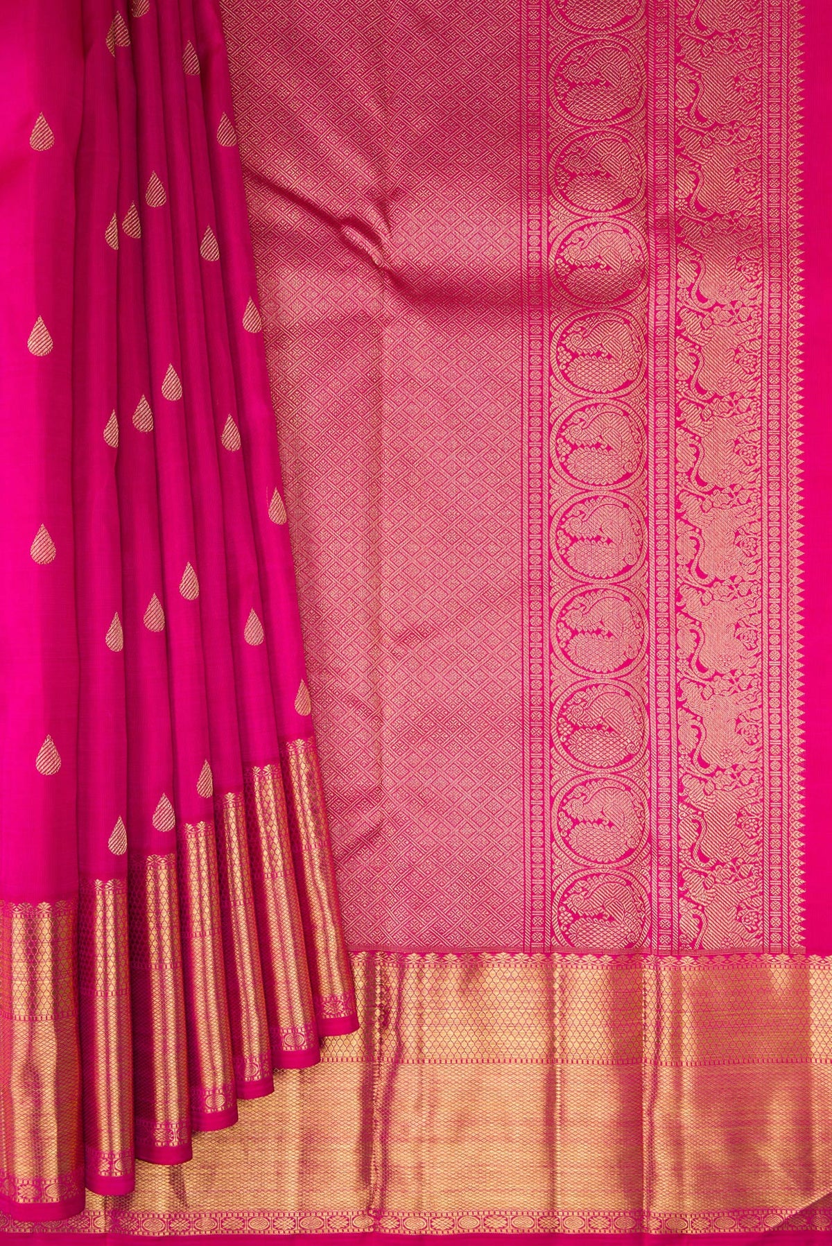 Pleats and pallu of Pure Silk Pure Zari Dark Pink Kanjivaram Saree with Zari Butta on the body and Zari Border. 