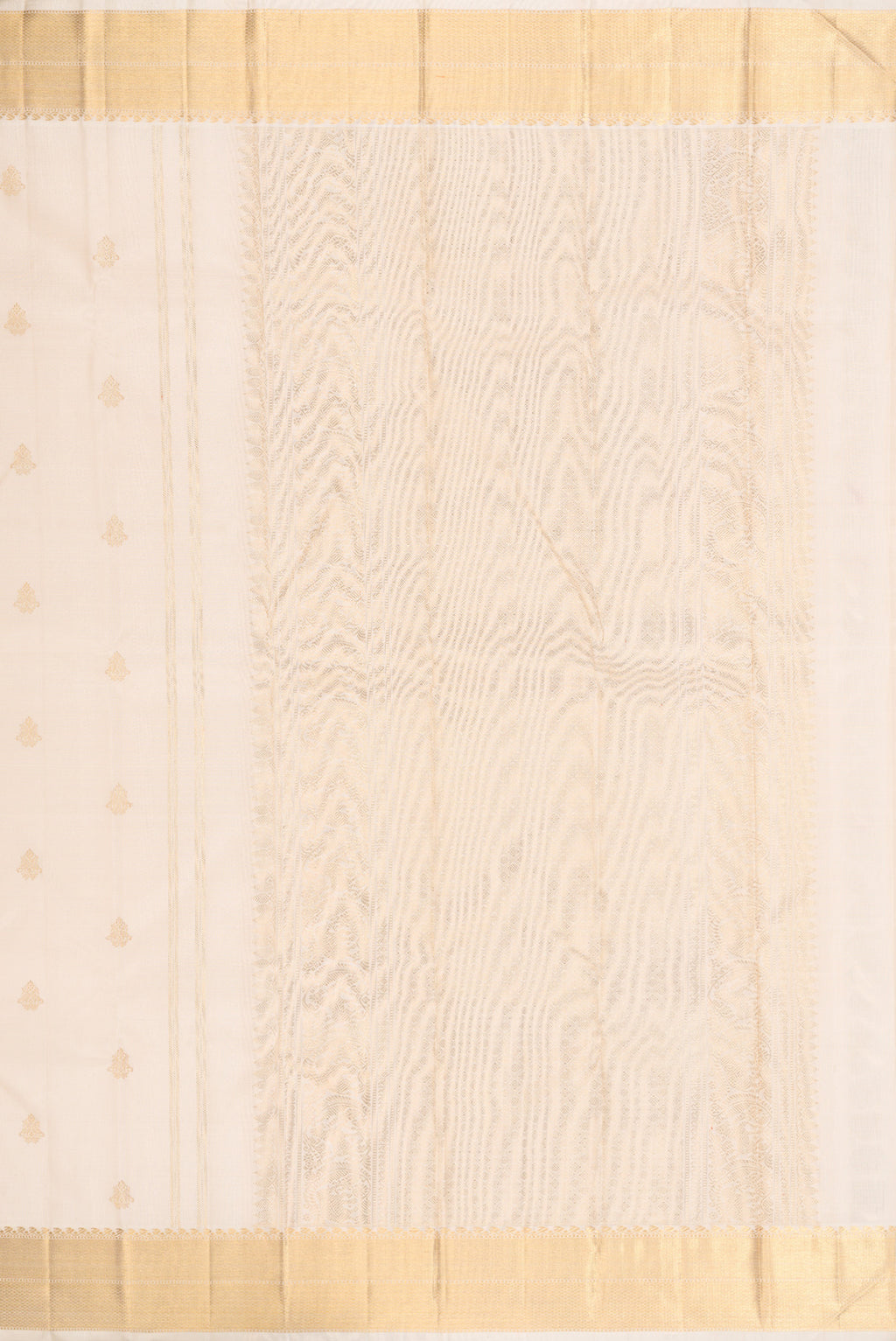 Close up image of the pallu of Pure Silk Pure Zari Off White Kanjivaram Saree with Zari Butta on the body and Zari Border. 