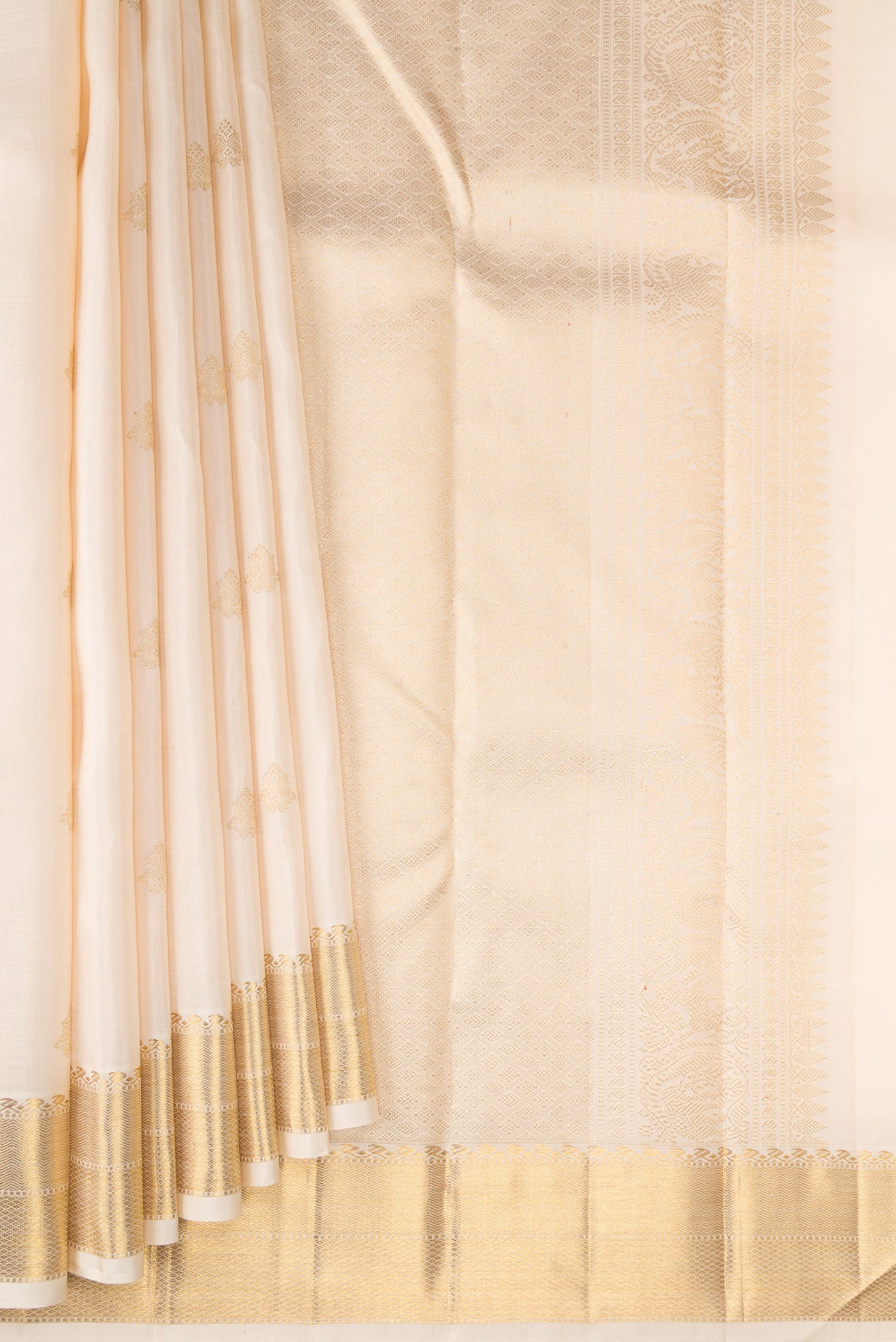 Pleats and pallu of Pure Silk Pure Zari Off White Kanjivaram Saree with Zari Butta on the body and Zari Border. 