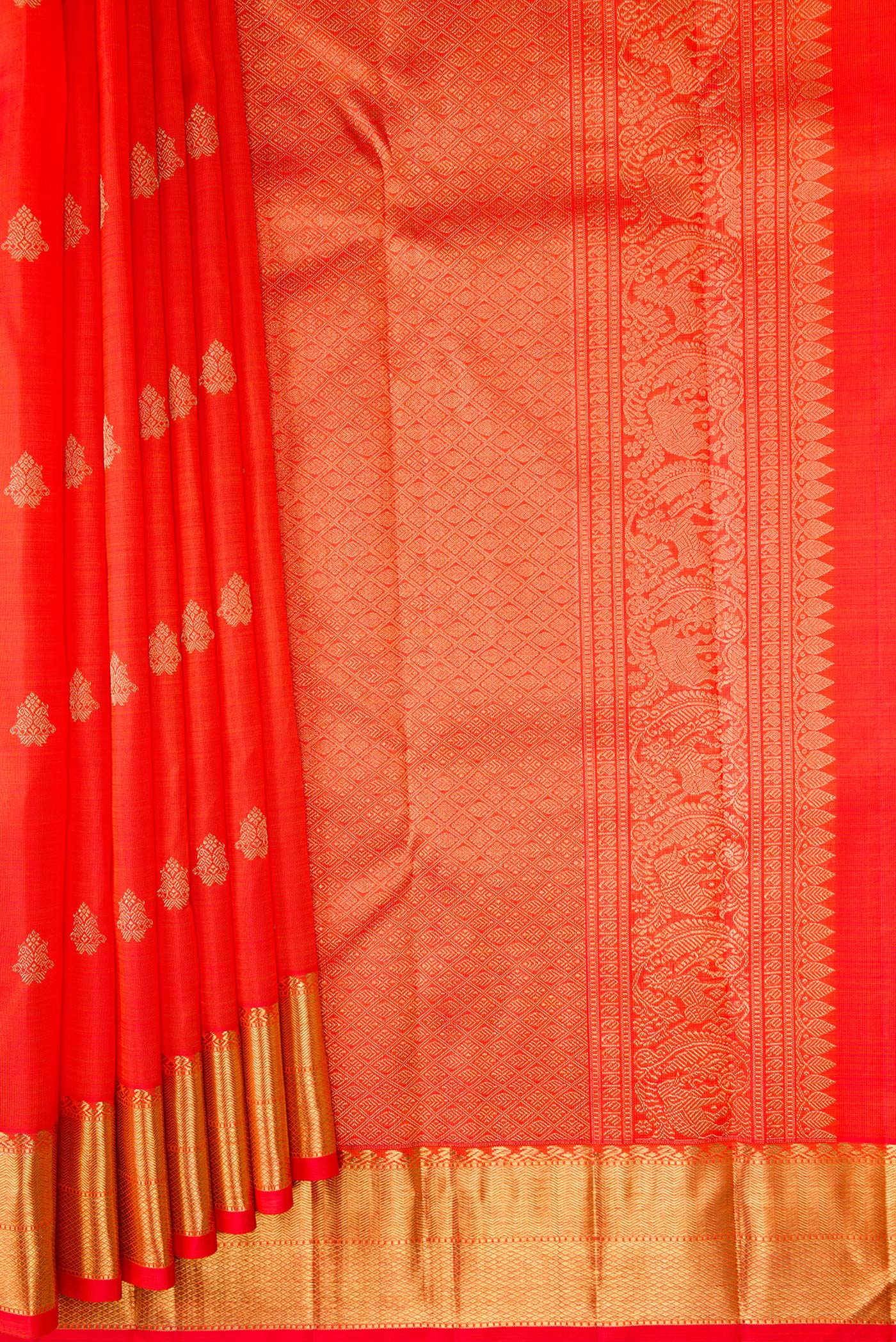 Pleats and pallu of Pure Silk Pure Zari Orange Dual Tone Kanjivaram Saree with Zari Butta on the body and Zari Border. 