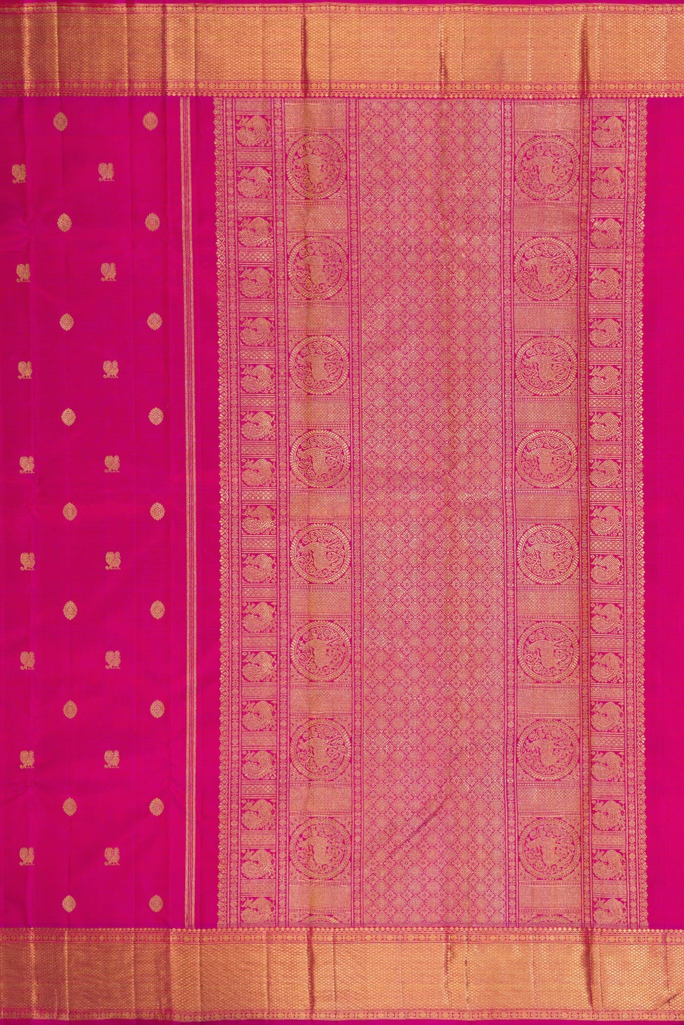 Close up image of the pallu of Pure Silk Pure Zari Magenta Kanjivaram Saree with Zari Butta on the body and Zari Border. 