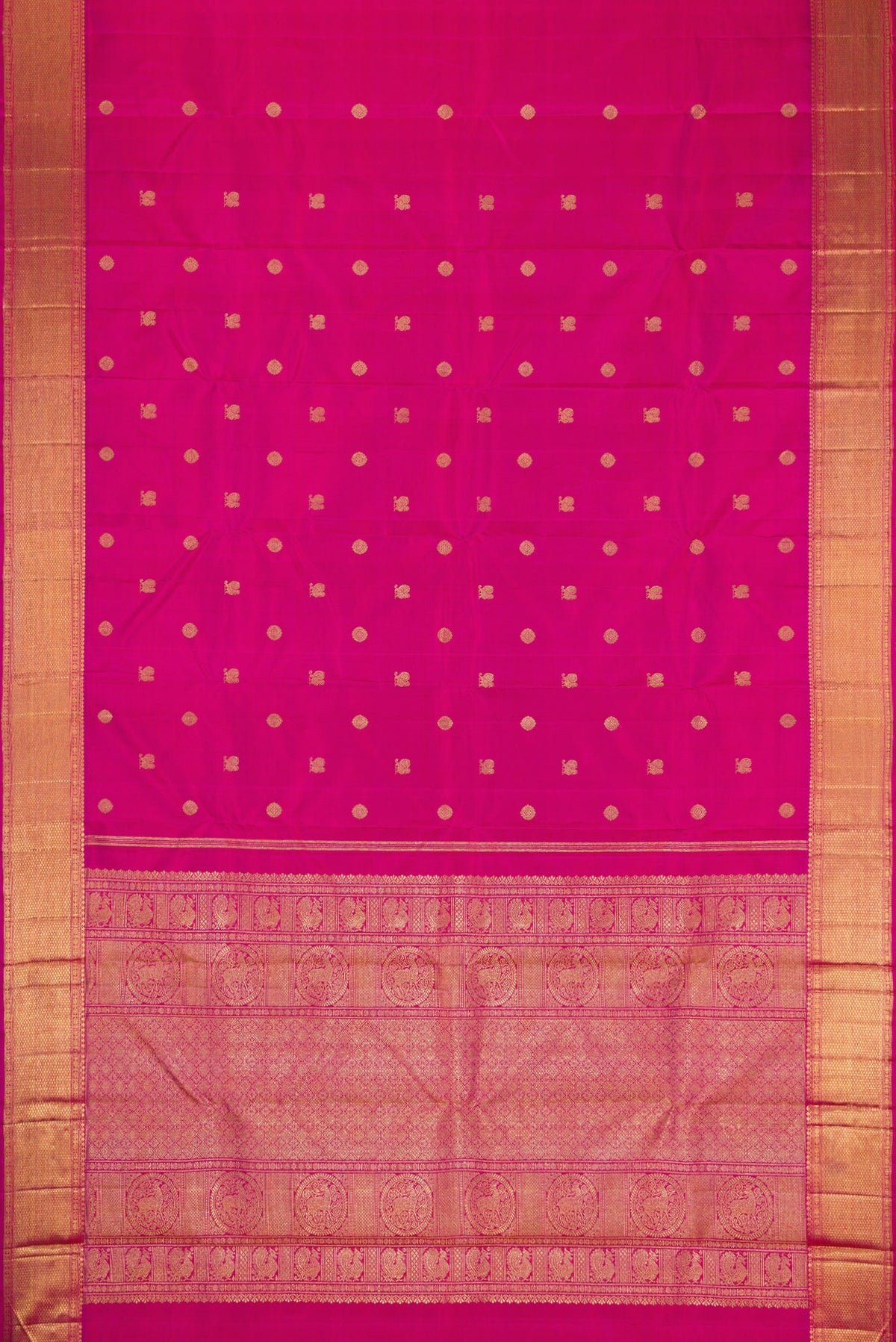 Flat view of Pure Silk Pure Zari Magenta Kanjivaram Saree with Zari Butta on the body and Zari Border. 