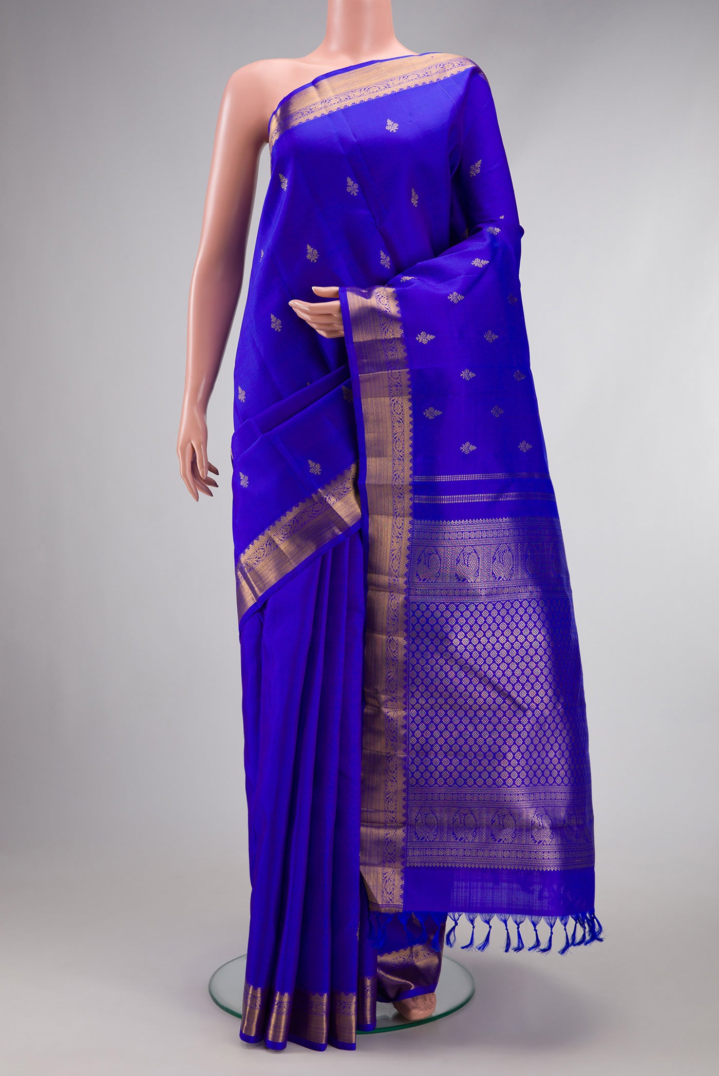 Pure Silk Pure Zari Royal Blue Dual Tone Kanjivaram Saree with Zari Butta on the body and Zari Border.  displayed on a mannequin