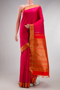 Pure Silk Pure Zari Pink Kanjivaram Saree with Zari Butta on the body and Zari Border.  displayed on a mannequin