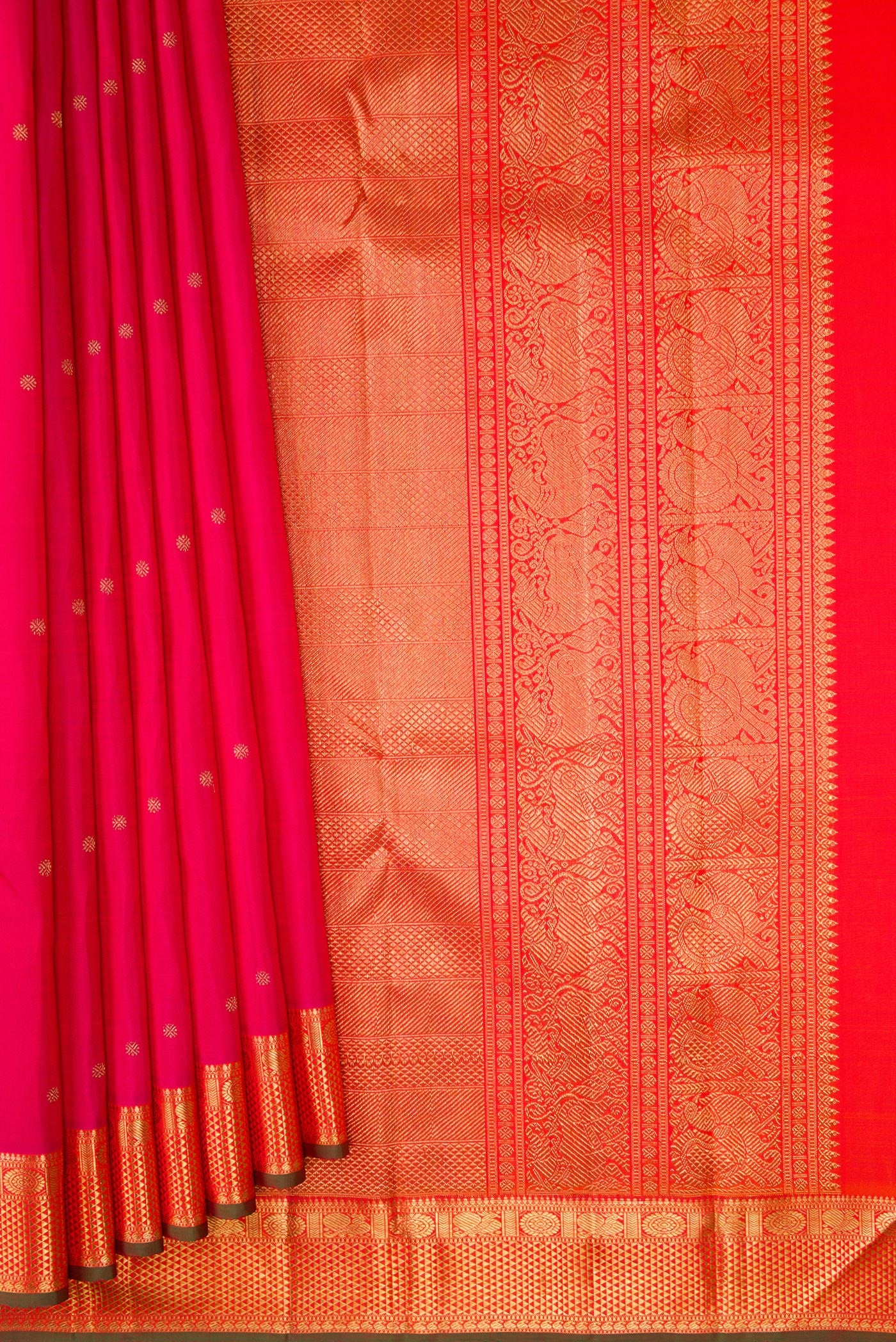 Pleats and pallu of Pure Silk Pure Zari Pink Kanjivaram Saree with Zari Butta on the body and Zari Border. 