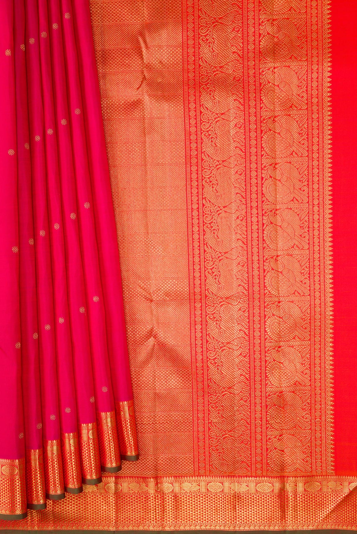 Pleats and pallu of Pure Silk Pure Zari Pink Kanjivaram Saree with Zari Butta on the body and Zari Border. 