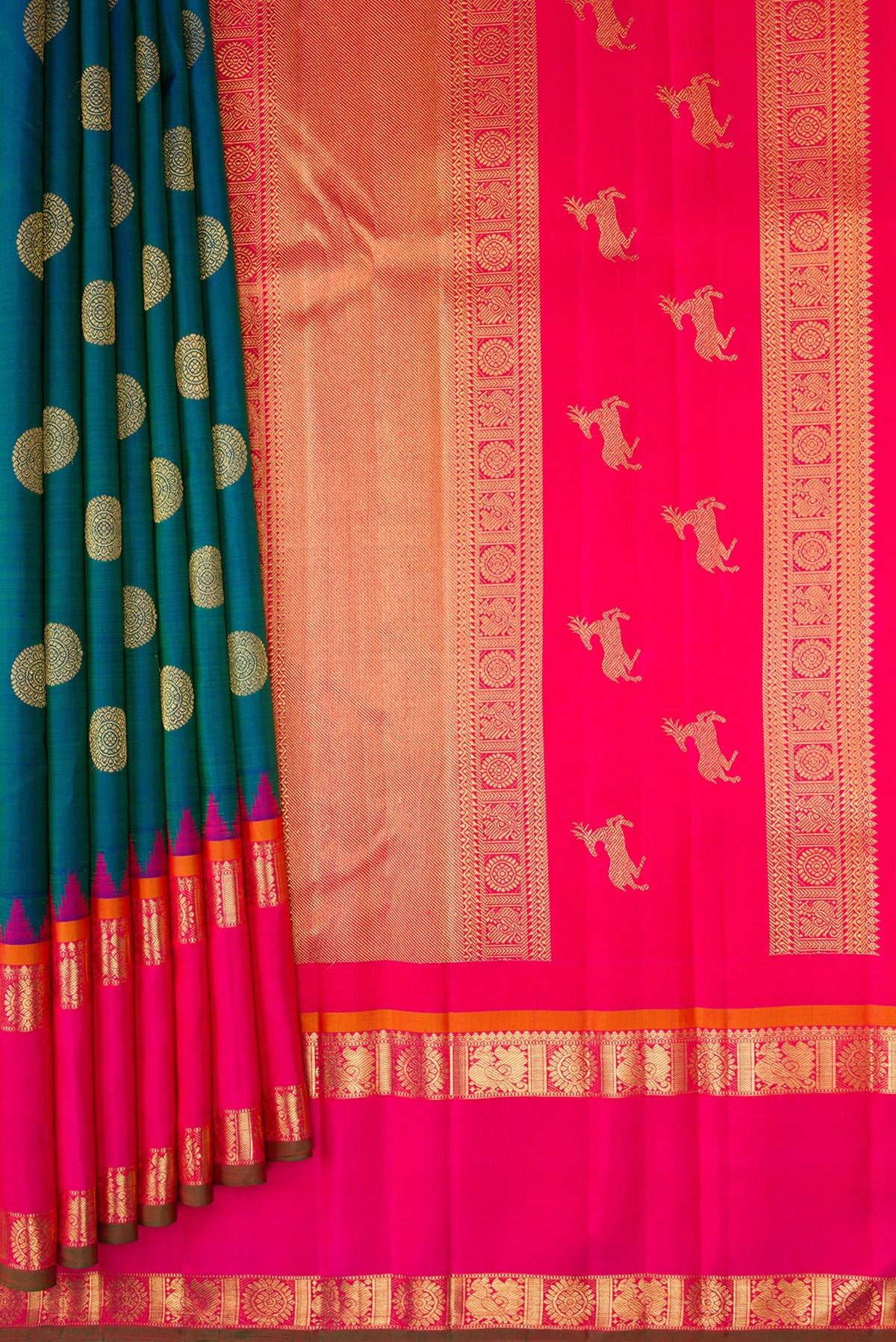 Pleats and pallu of Pure Silk Pure Zari Peacock Blue Kanjivaram Saree with Zari Butta on the body and Zari Border. 