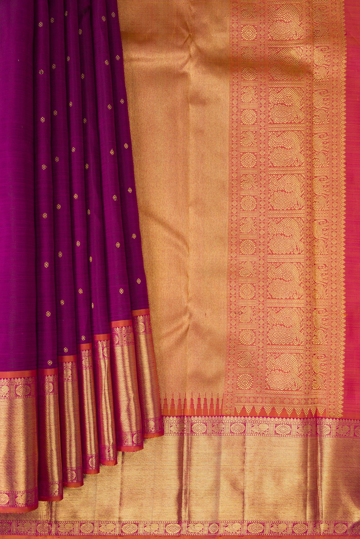 Pleats and pallu of Pure Silk Pure Zari Purple Kanjivaram Saree with Zari Butta on the body and Zari Border. 