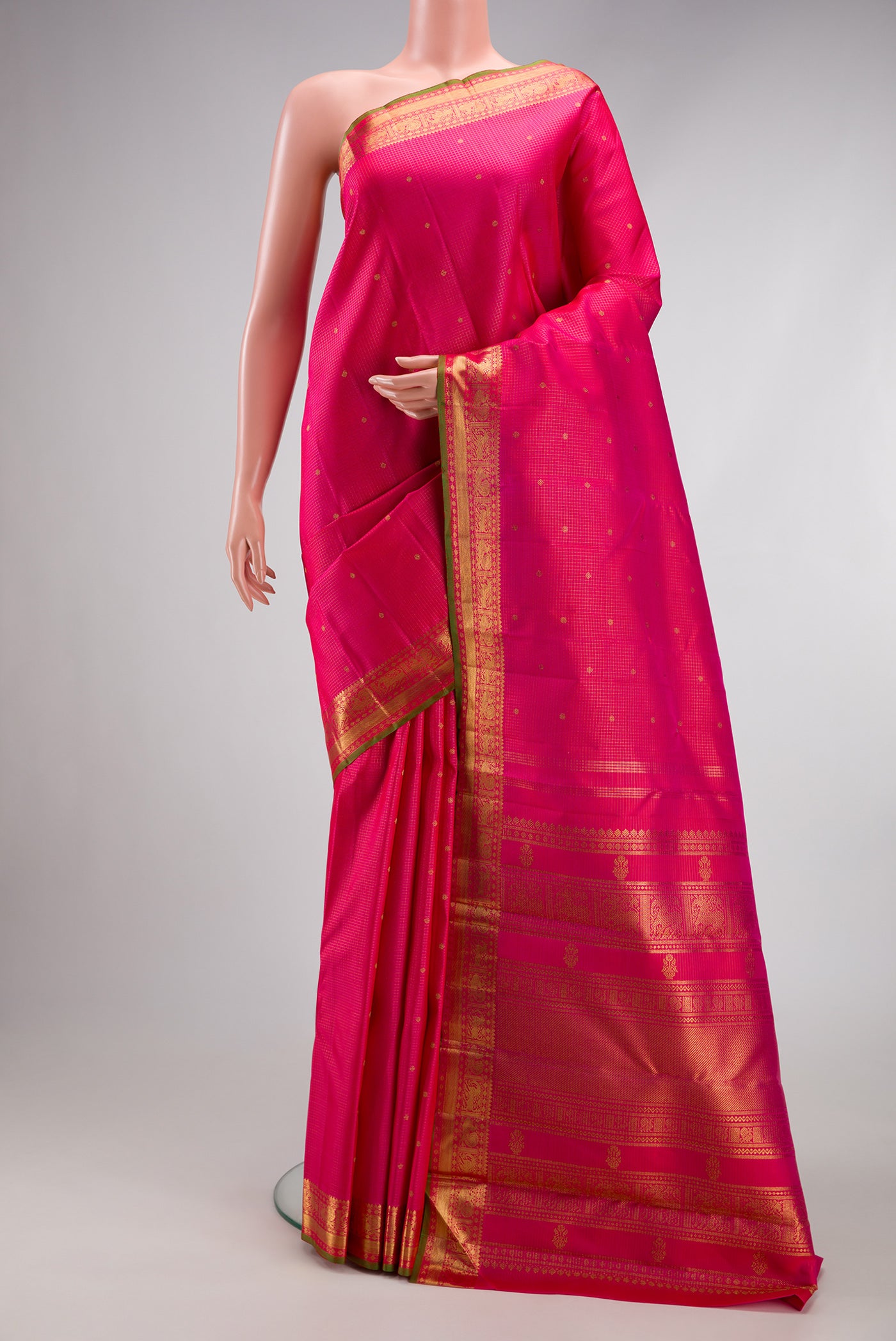 Pure Silk Pure Zari Pink Kanjivaram Saree with Checked design on the body and Zari Border.  displayed on a mannequin