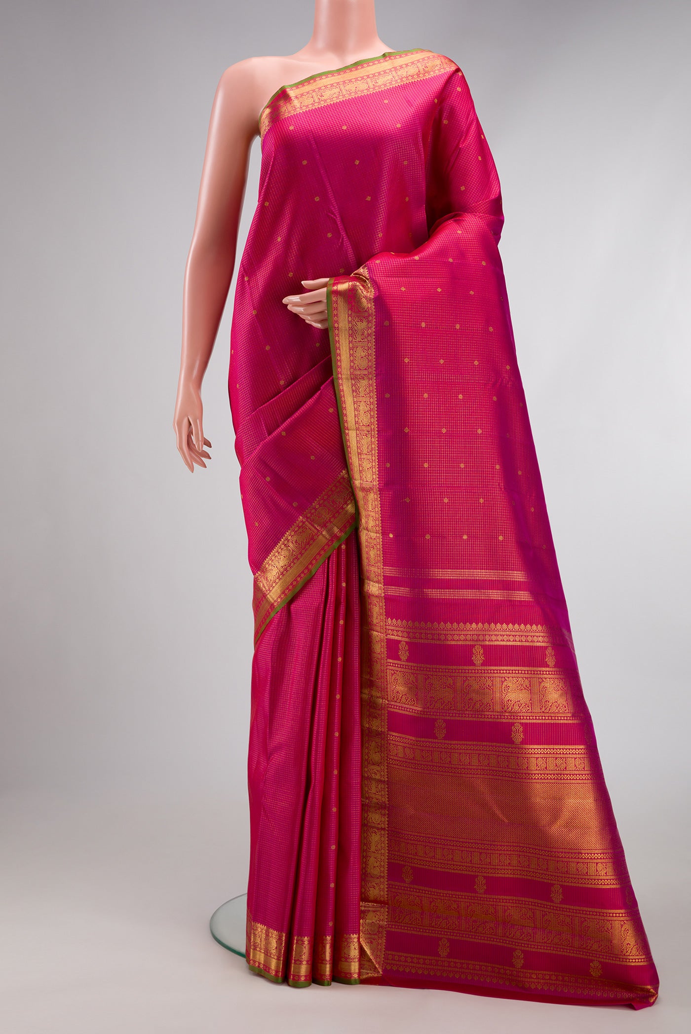 Pure Silk Pure Zari Dark Pink Kanjivaram Saree with Checked design on the body and Zari Border.  displayed on a mannequin