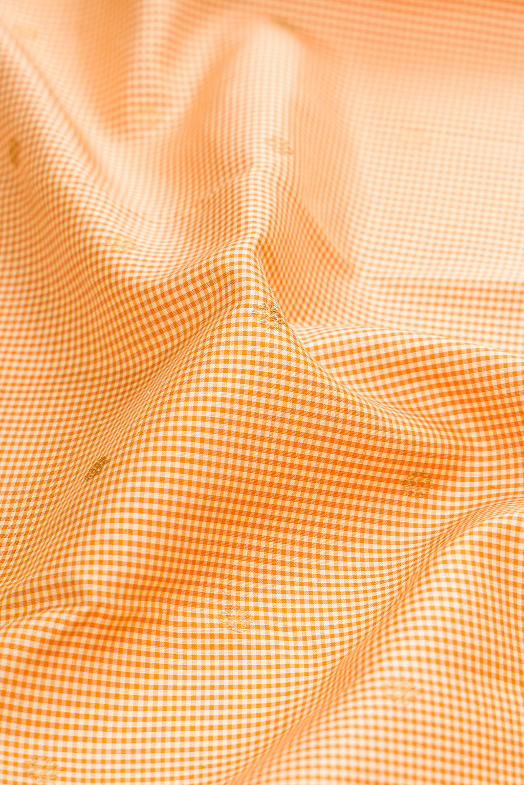 Close up of Pure Silk Pure Zari Sandal Kanchipuram Saree with Checked design on the body and Zari Border.  displaying folds